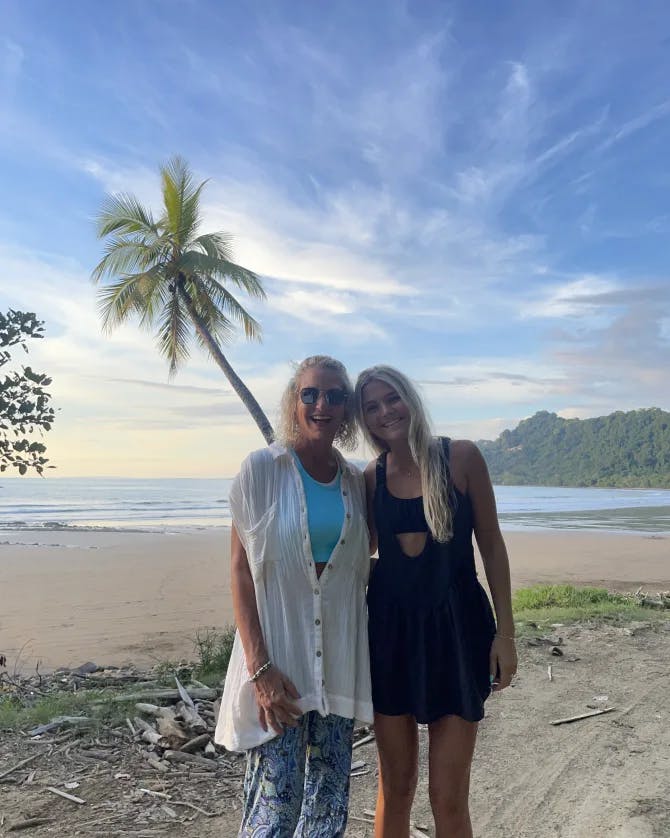 Picture of Tracy with friend on a beach