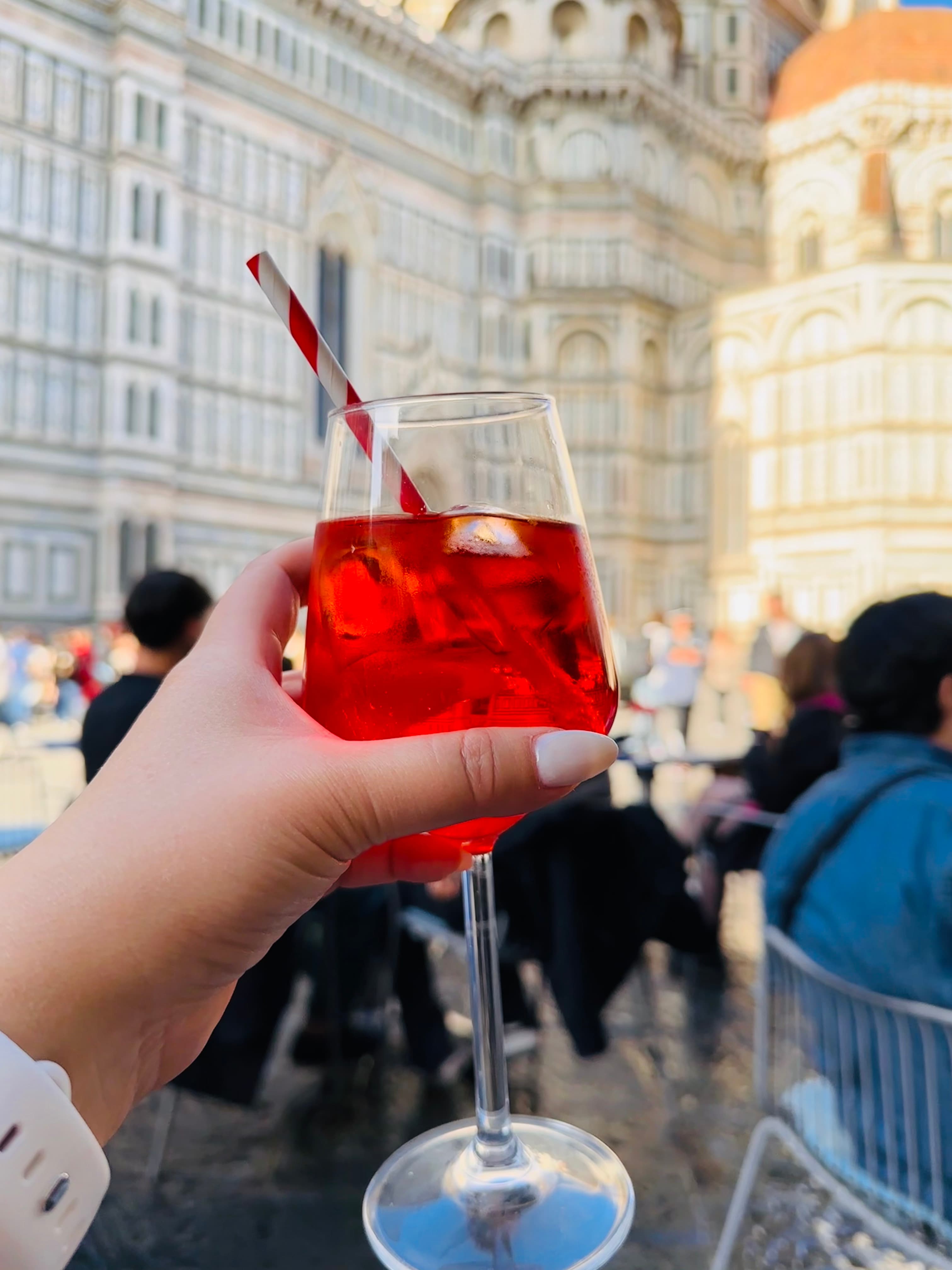 Picture of red drink in hand