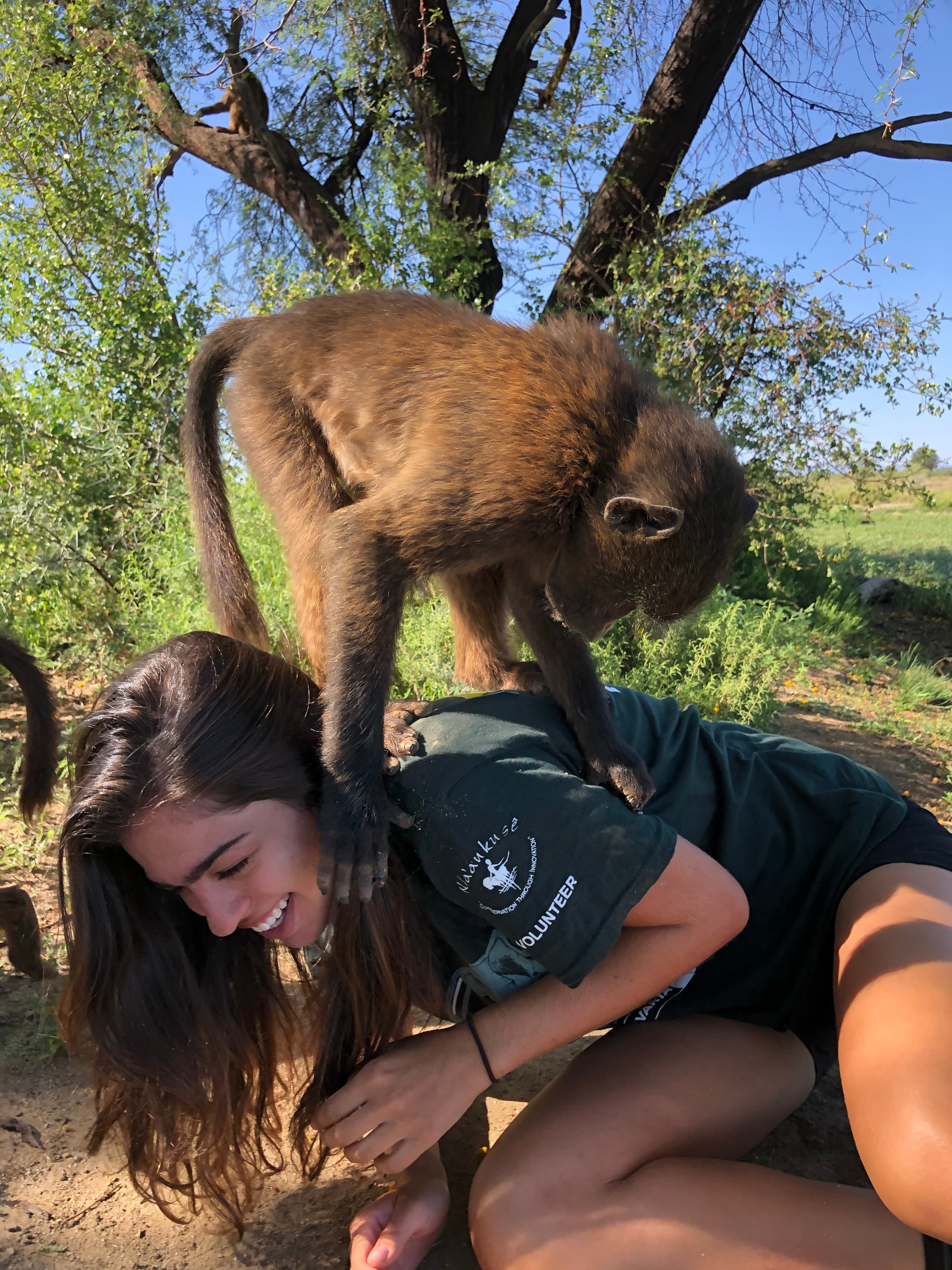Travel advisor posing with a monkey