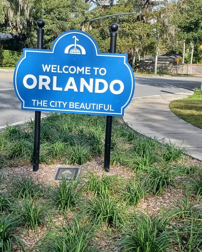 An Orlando sign board on the road