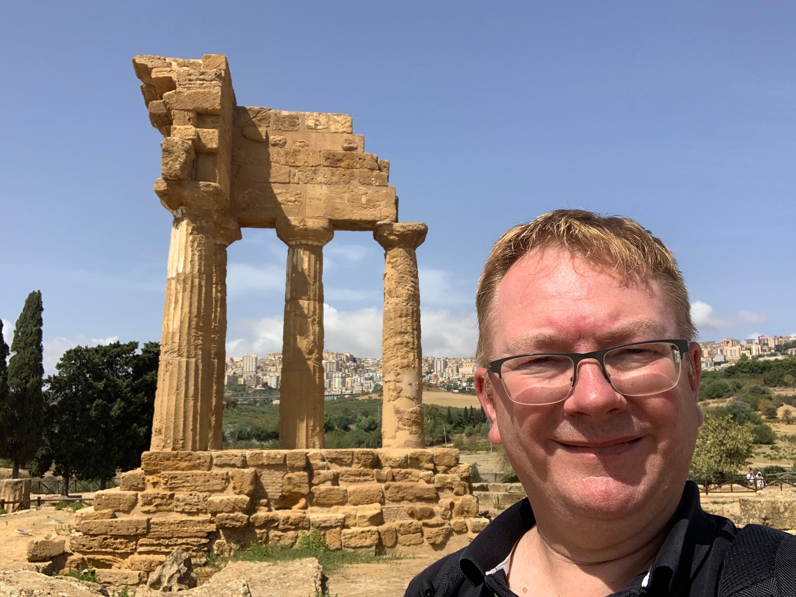 Pat taking a selfie of himself in front of the Temple of the Dioscuri in Rome, Italy.