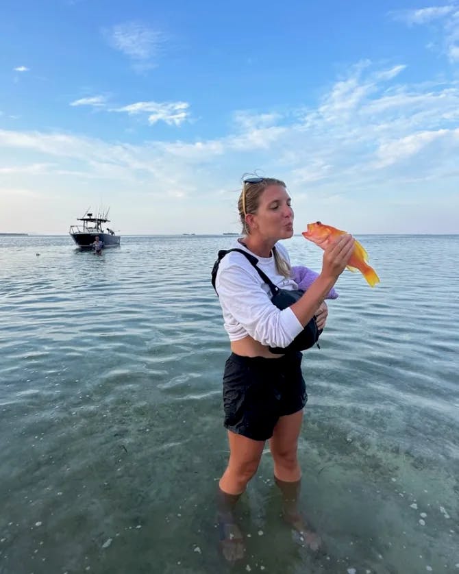 Picture of Chloe with fish in hand