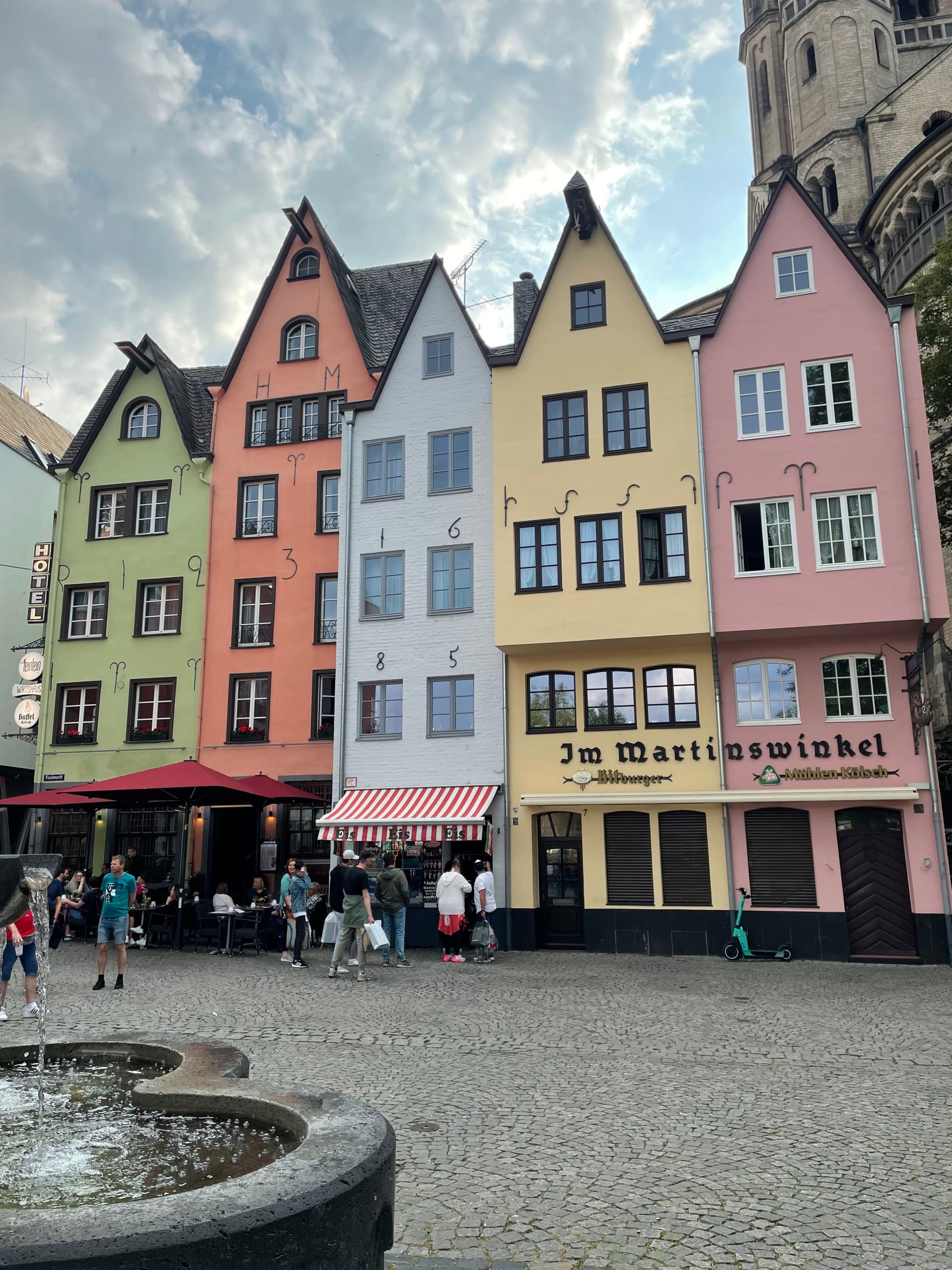 pastel colored buildings in a town square