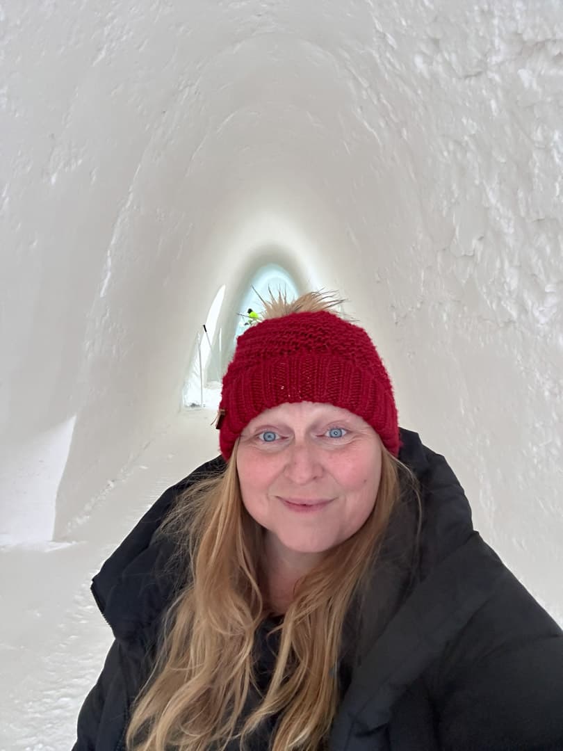 Karilyn taking a selfie of herself inside of an ice cave.
