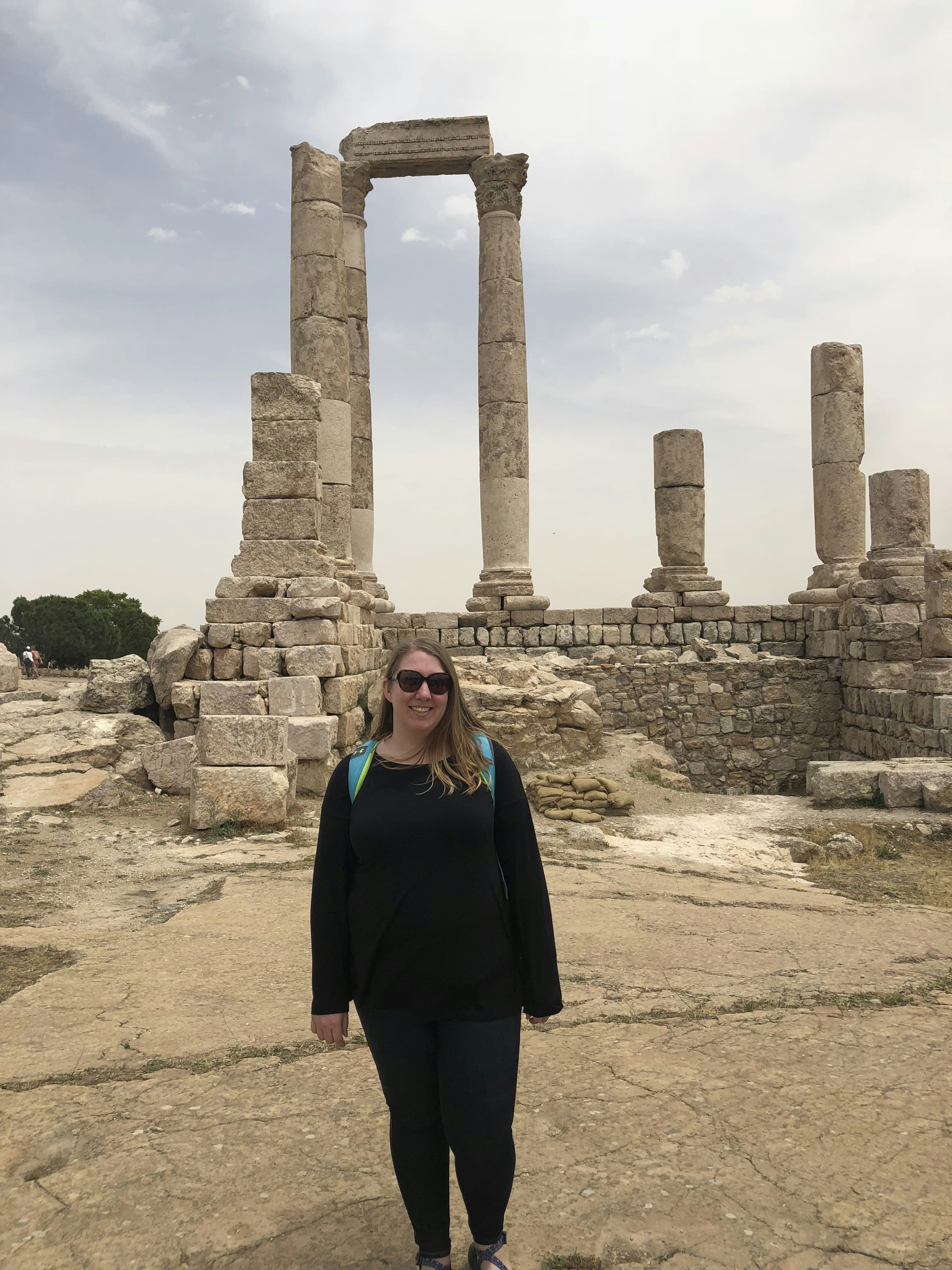 Travel advisor Katherine Daniels in front of ancient ruins