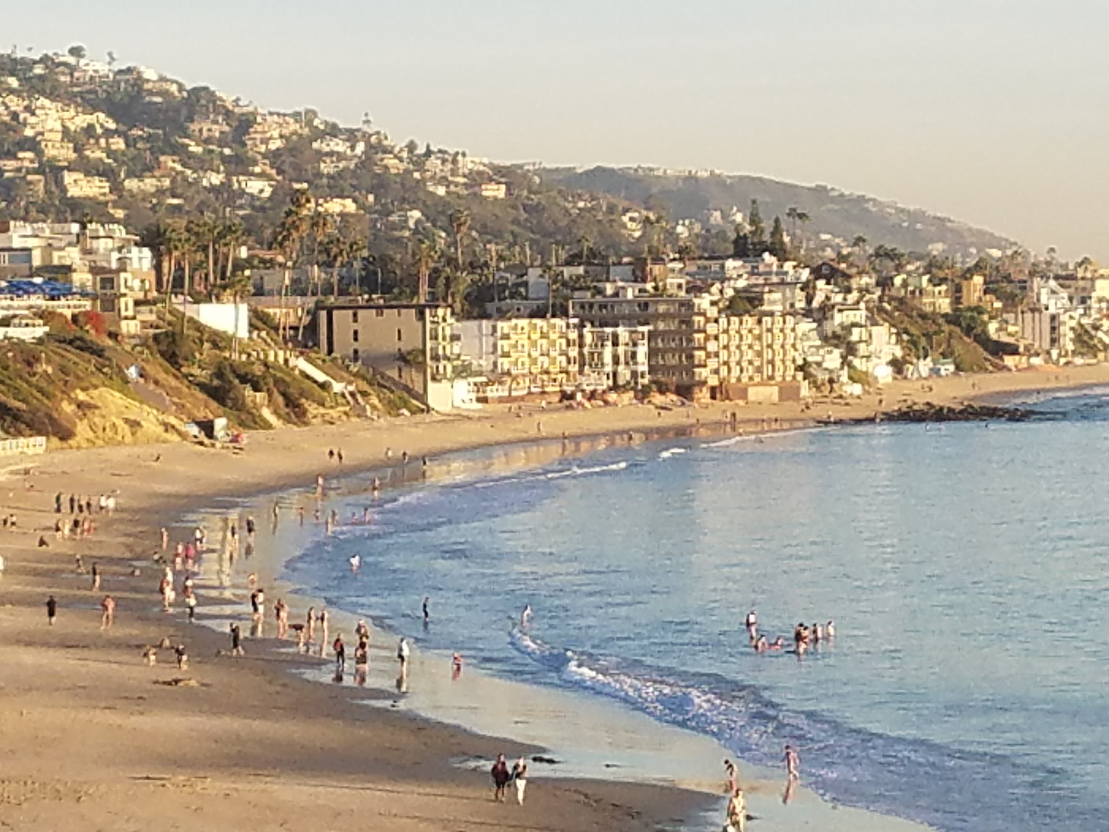 calm beach with swimmers and bathers