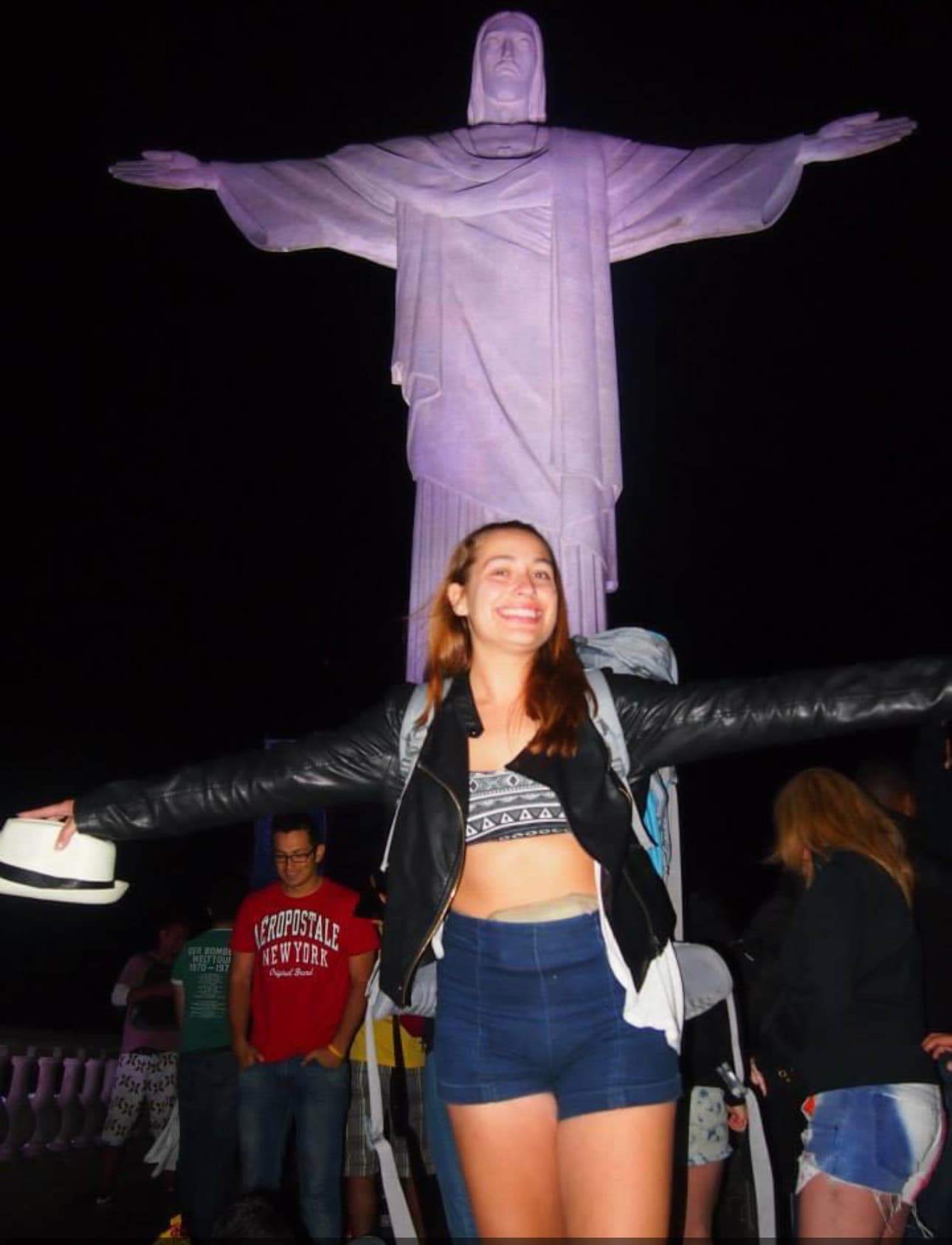 standing in front of statue