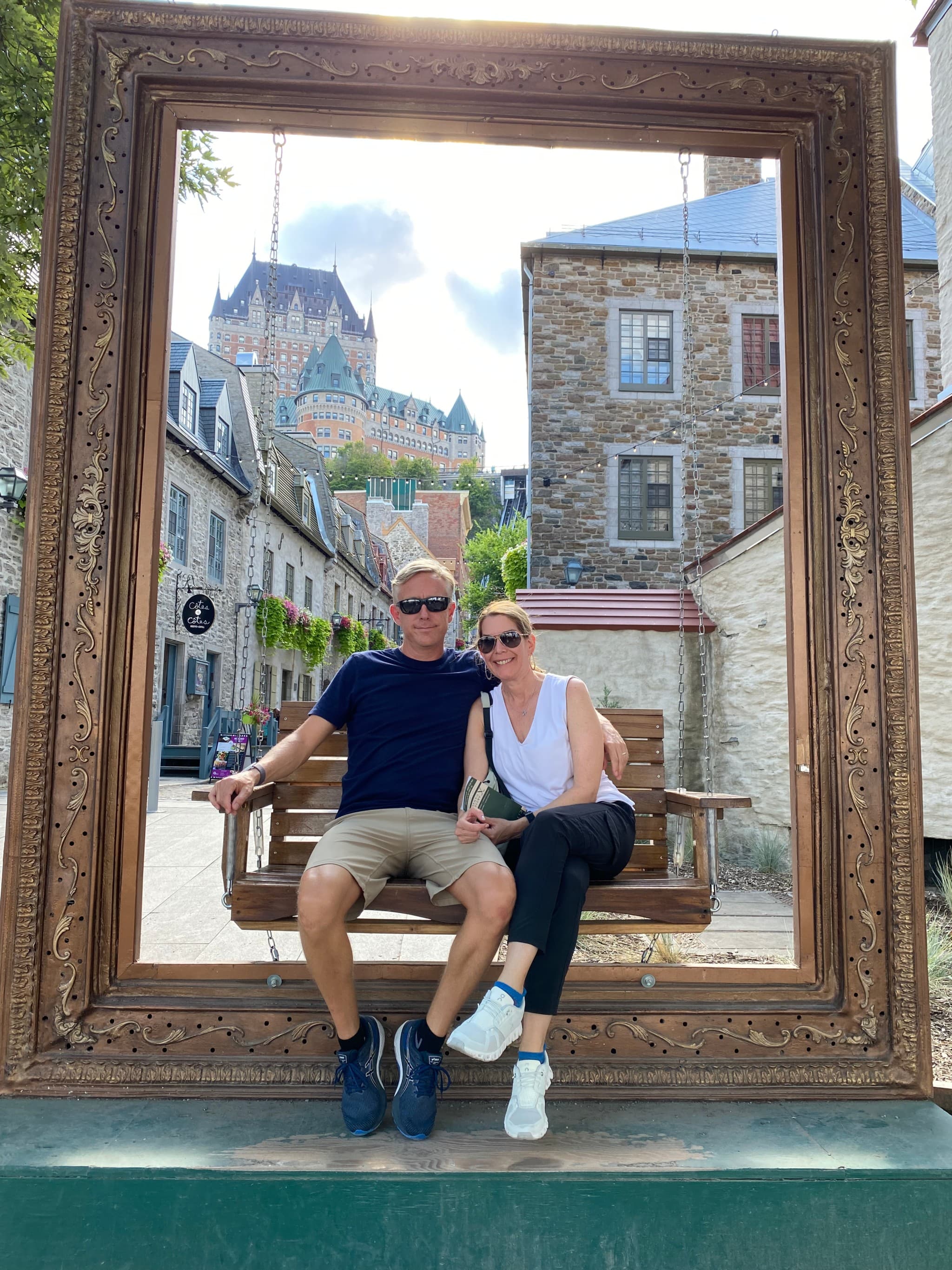Couple sitting in picture frame.