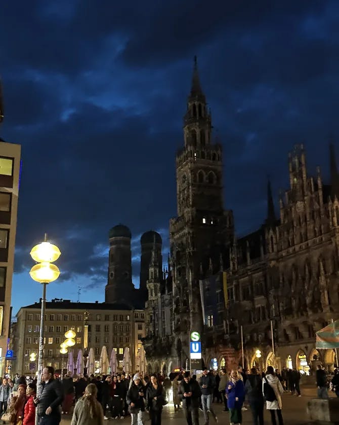 Picture of Marienplatz plaza at night crowded with people and street lamps