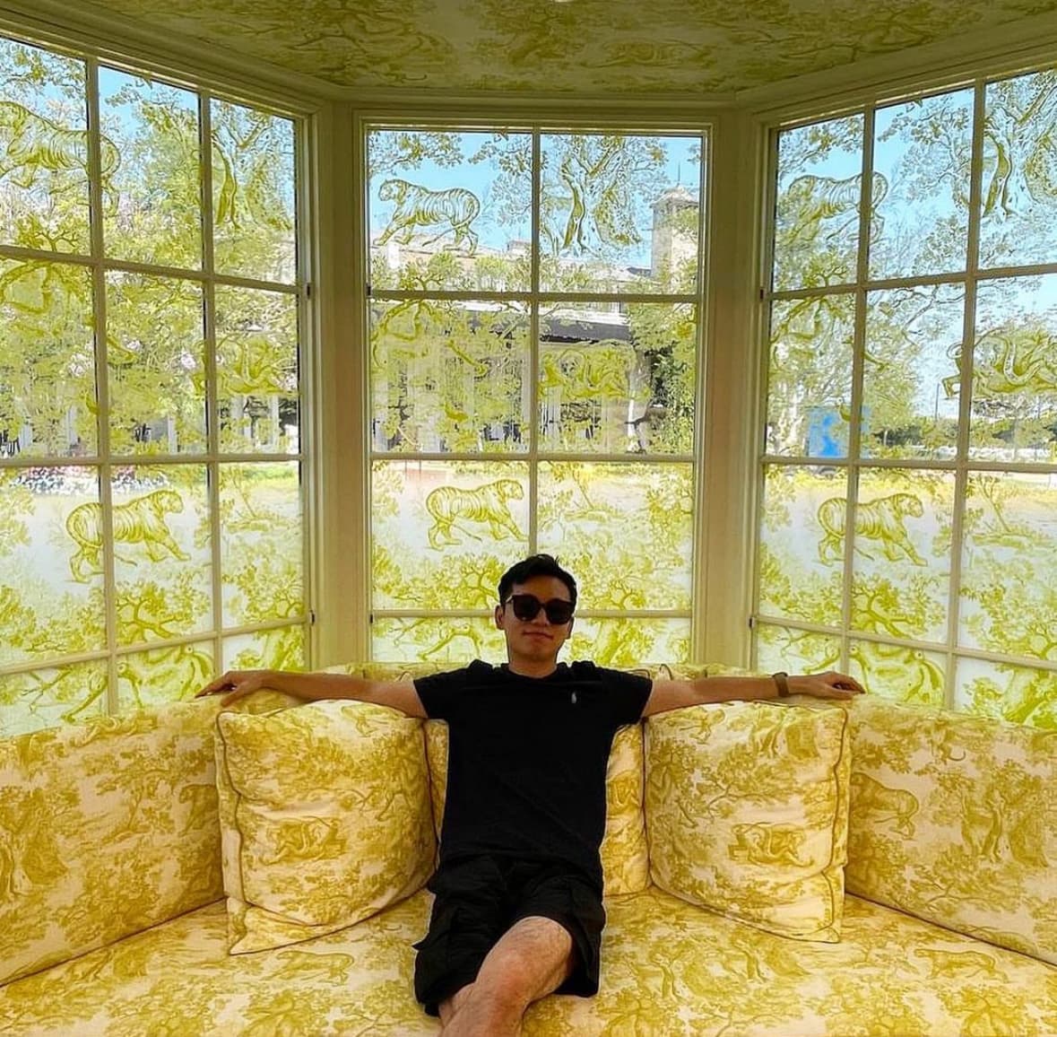 Posing for a photo sitting on a sofa