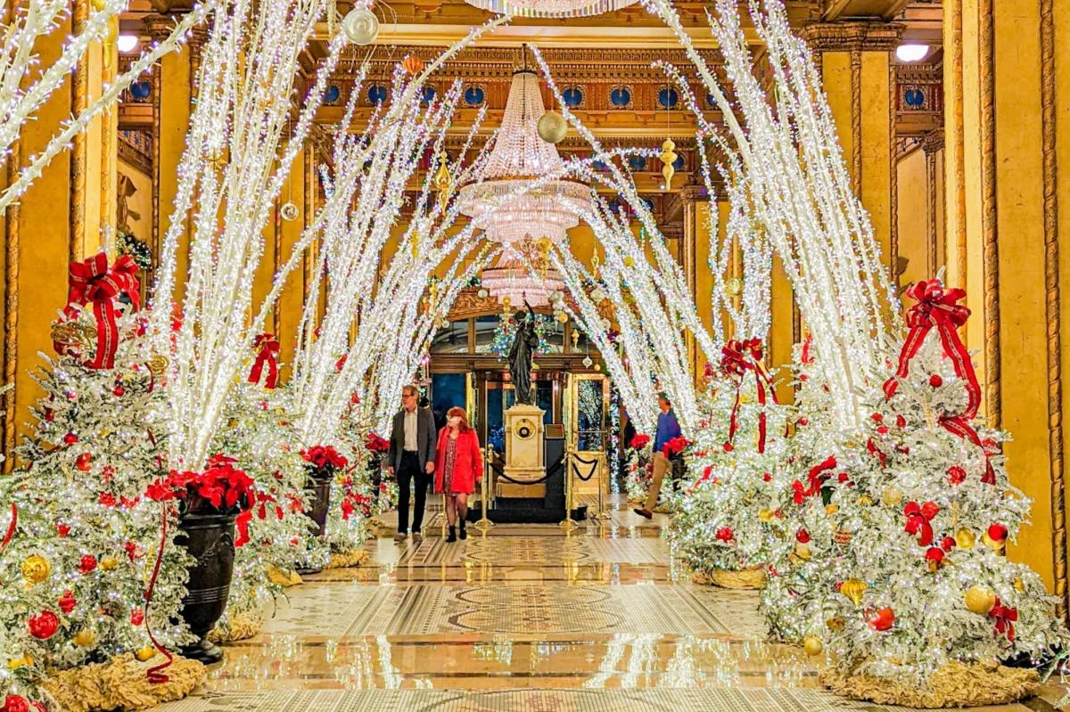 An exceptionally elaborate display of gold, silver and red decorations and lights fill the lobby of The Roosevelt hotel in New Orleans for Christmas