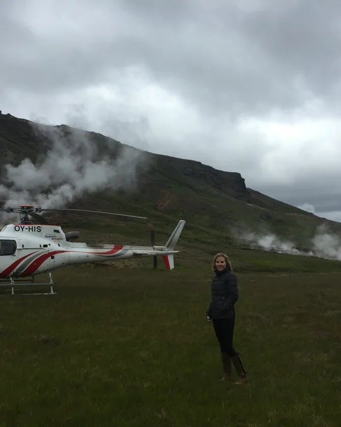 Posing for a picture with a helicopter