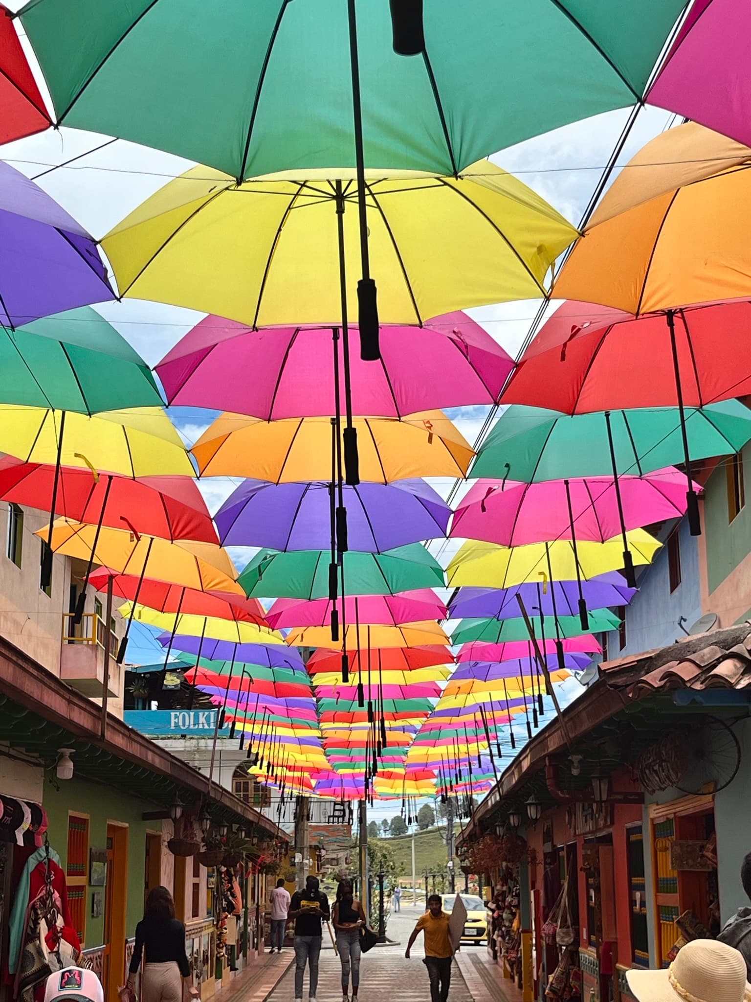 A street line with colorful umbrellas
