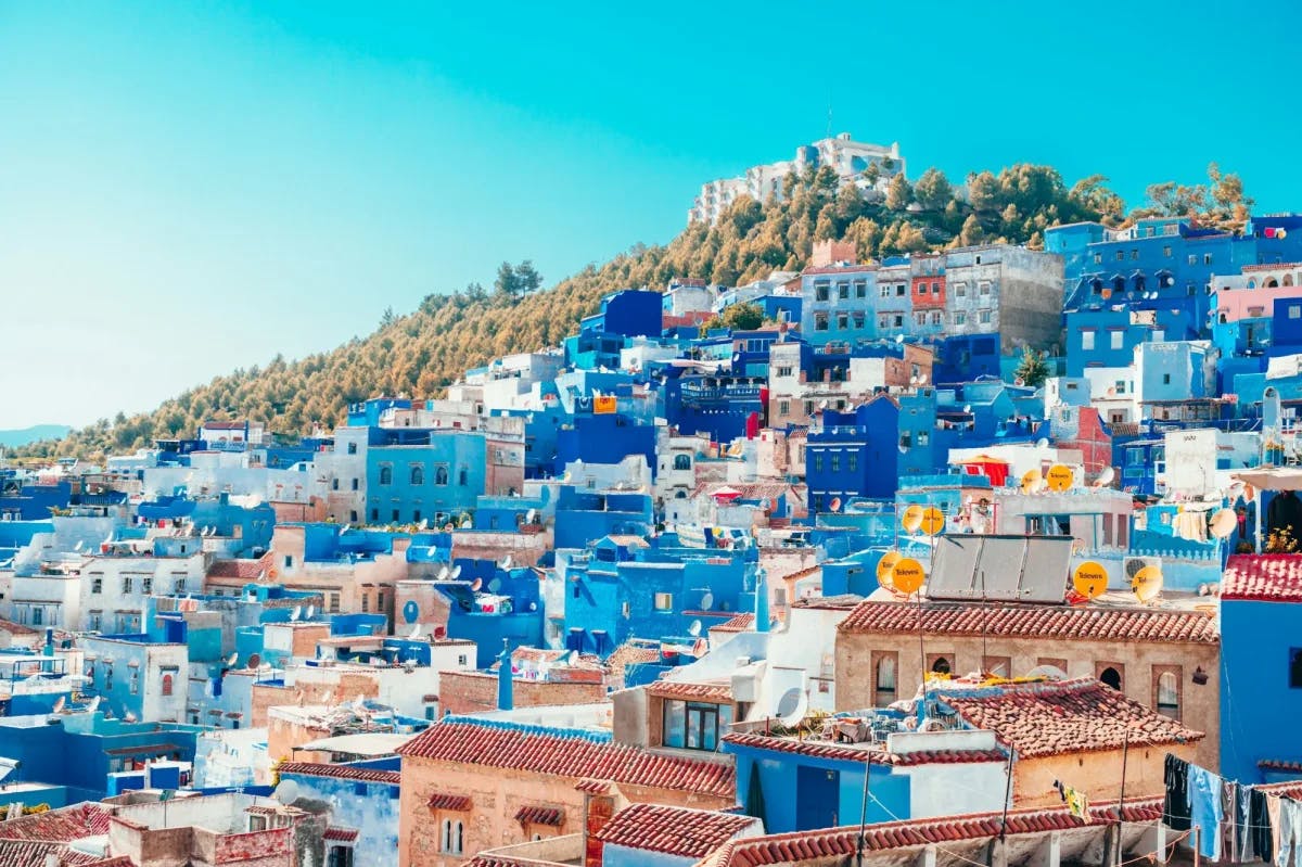 Dozens of blue-washed homes and businesses line the hills of Chefchaouen, Morocco