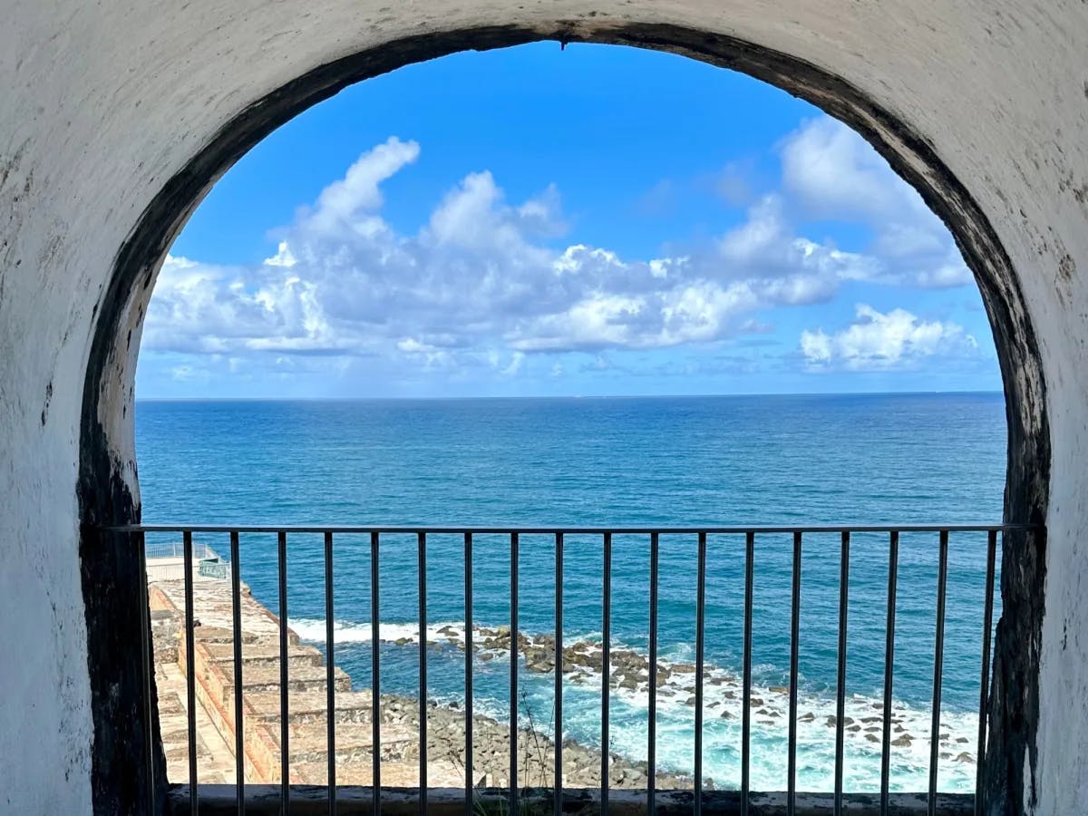 Ocean as seen from an arched opening.