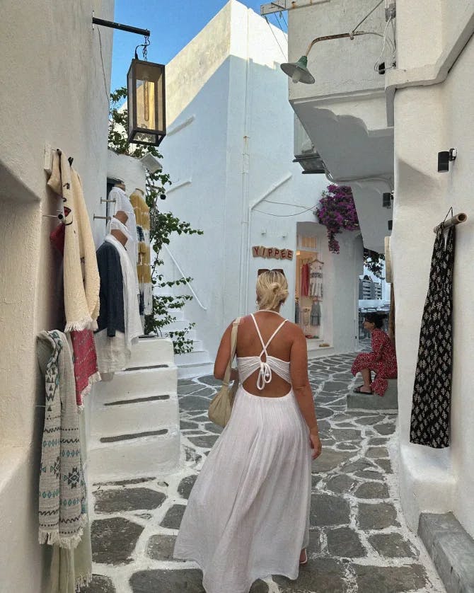 Picture of Lauren in white dress in street