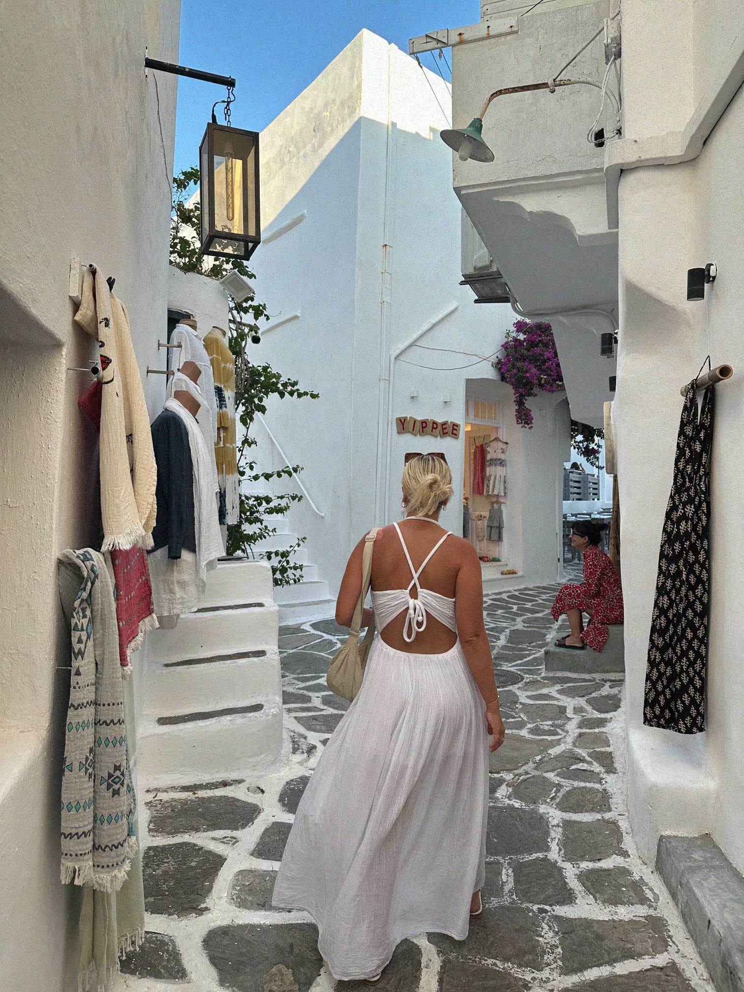 Picture of Lauren in white dress in street