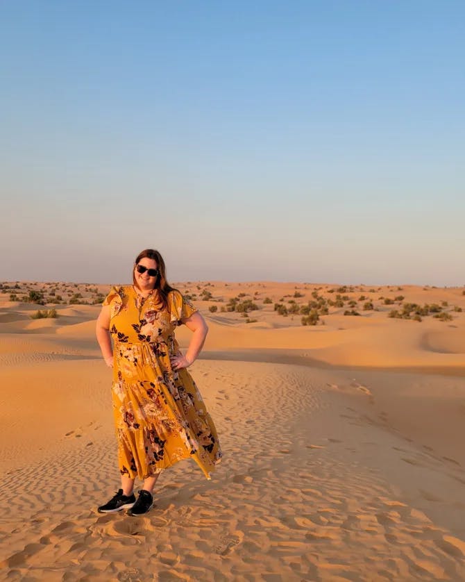 Travel Advisor Nadia Bess standing in a desert.