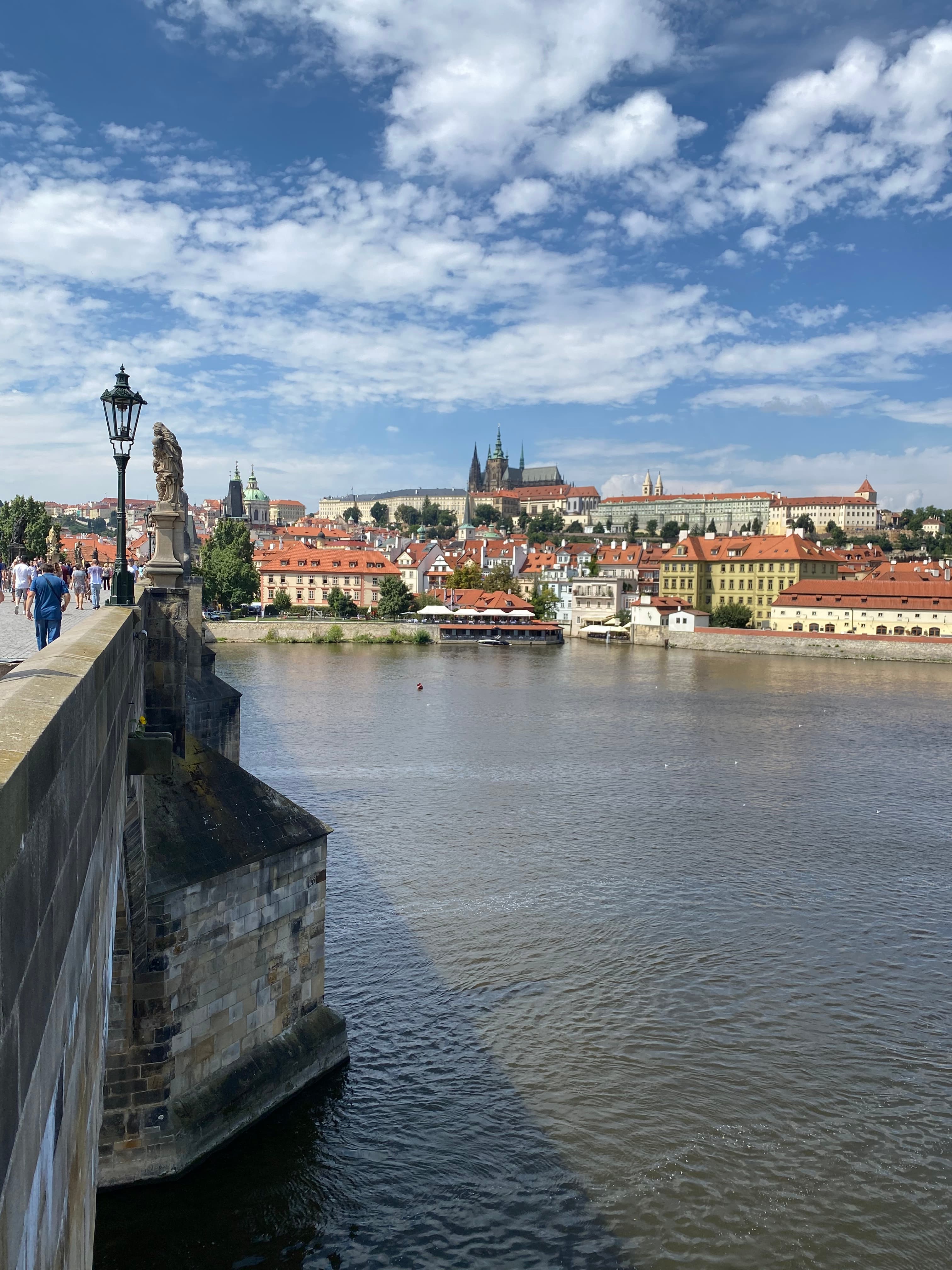 View of the water from the bridge with a lovely town in the distance