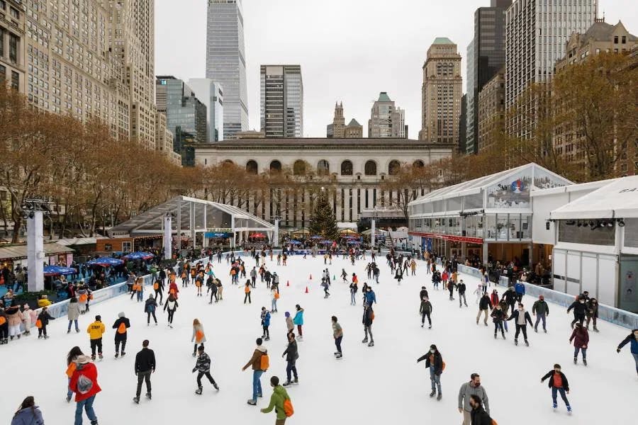 Bryant Park Winter Village is a festive, open-air holiday market in New York City offering ice skating, shopping, dining, and seasonal entertainment amidst a winter wonderland setting.