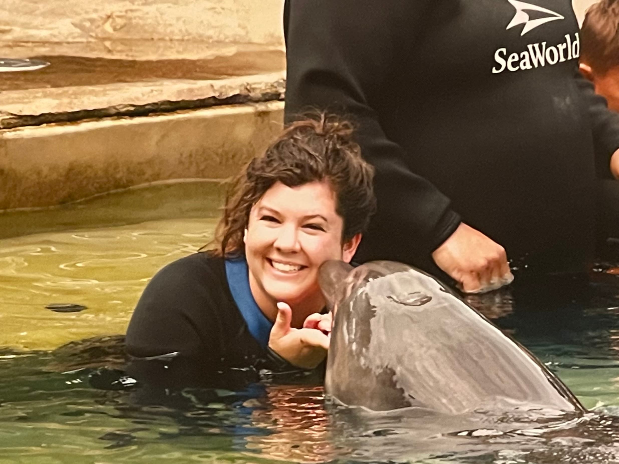Picture of Christina with dolphin