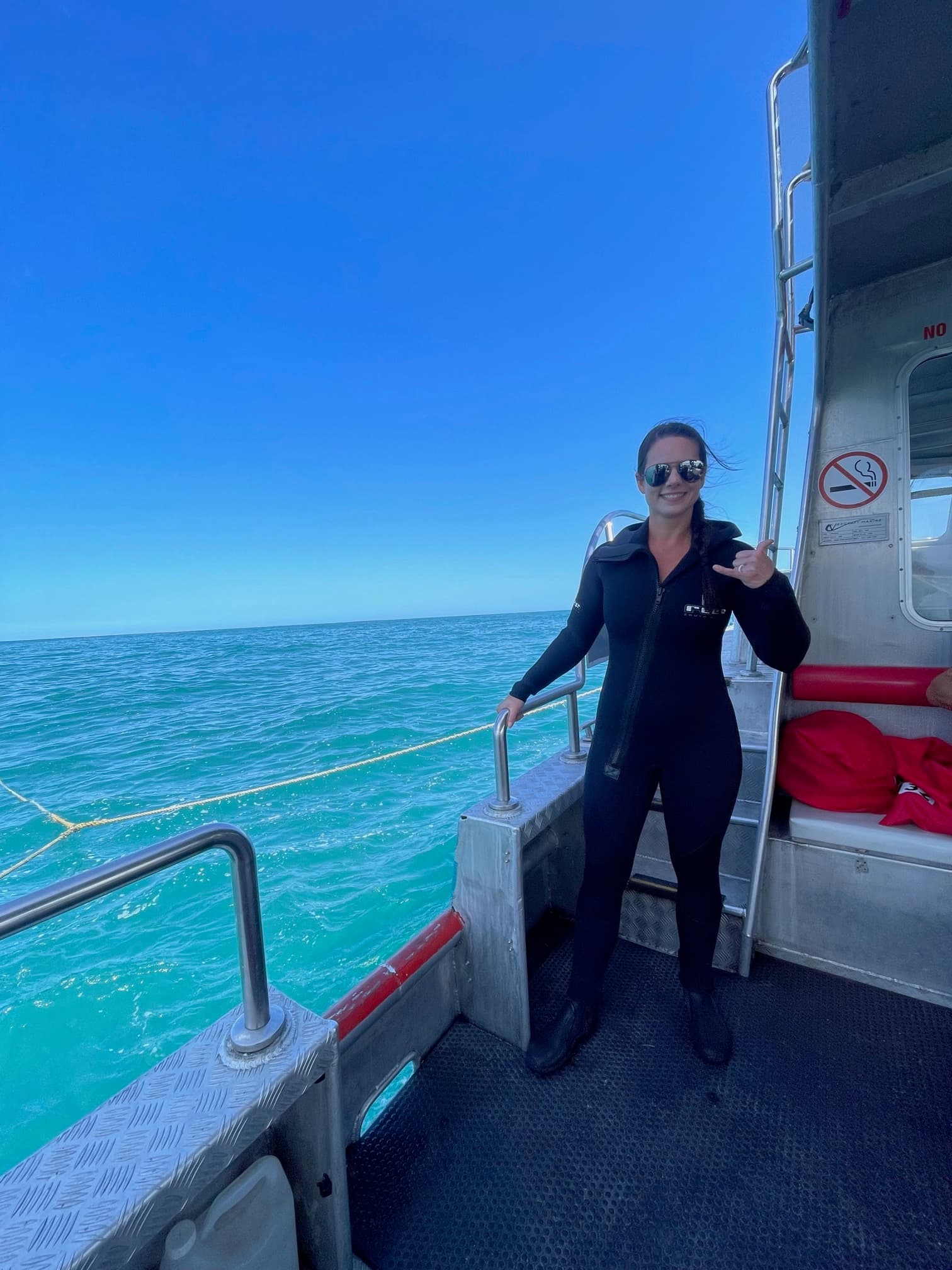 In the ocean on a boat.