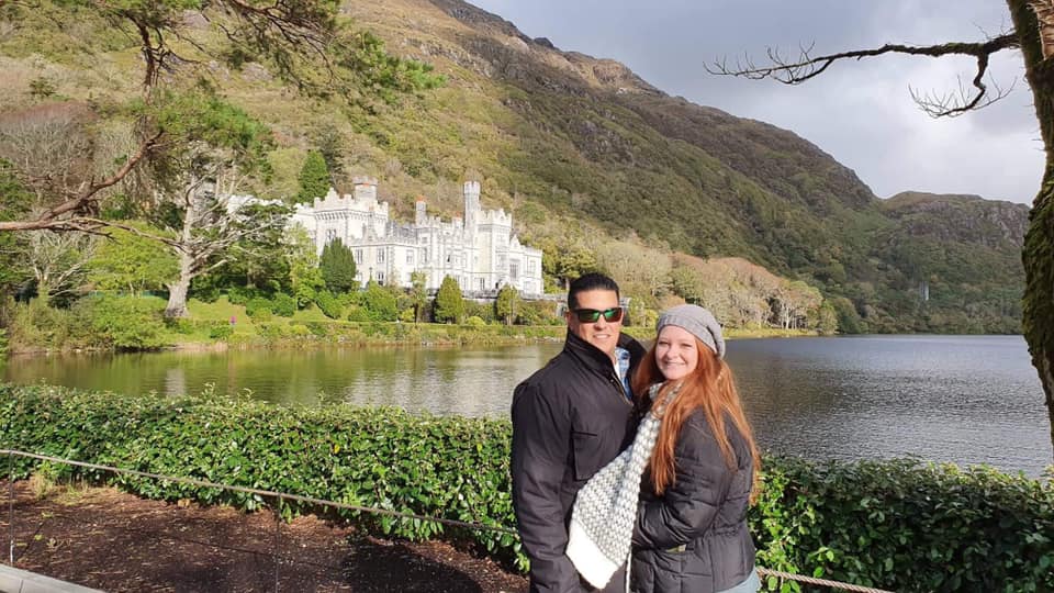 Couple posing beside sea