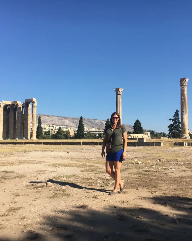 Ancient Greece standing next to columns.