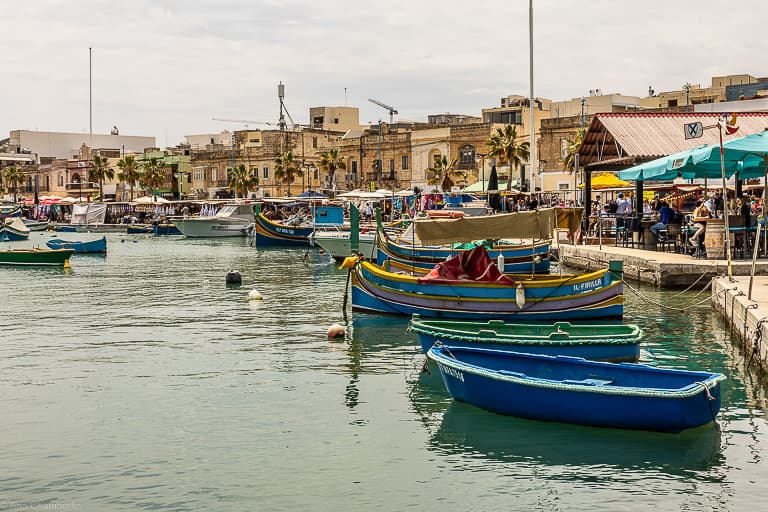 Boats parked in water bay