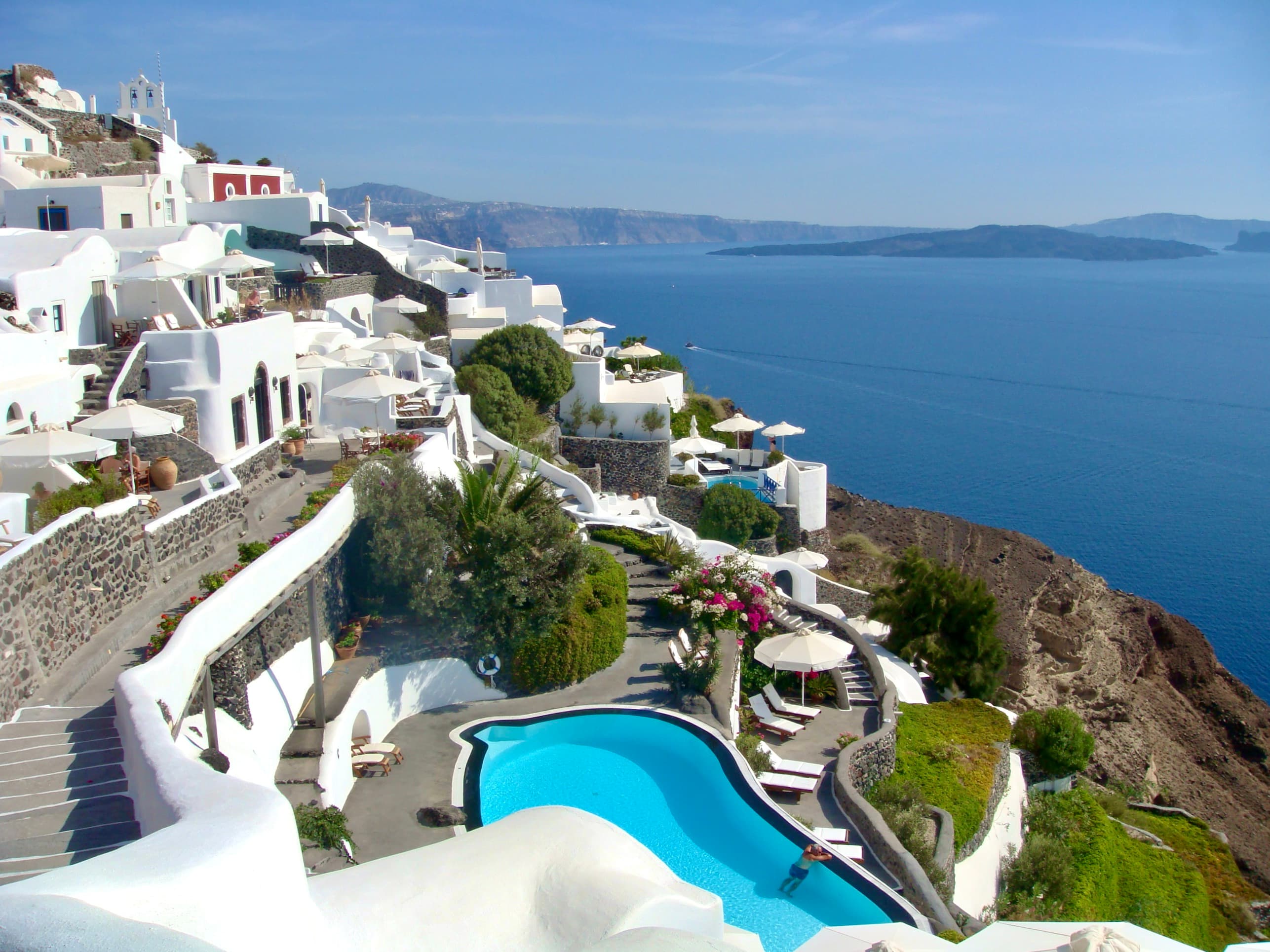 A scenic view featuring the white buildings adorned with vibrant rooftops.