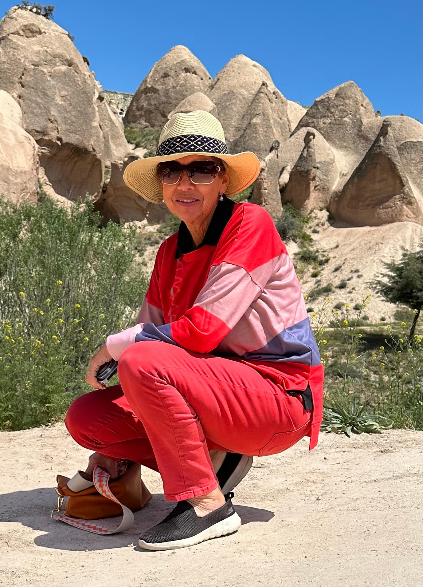 Posing by the rocky hills