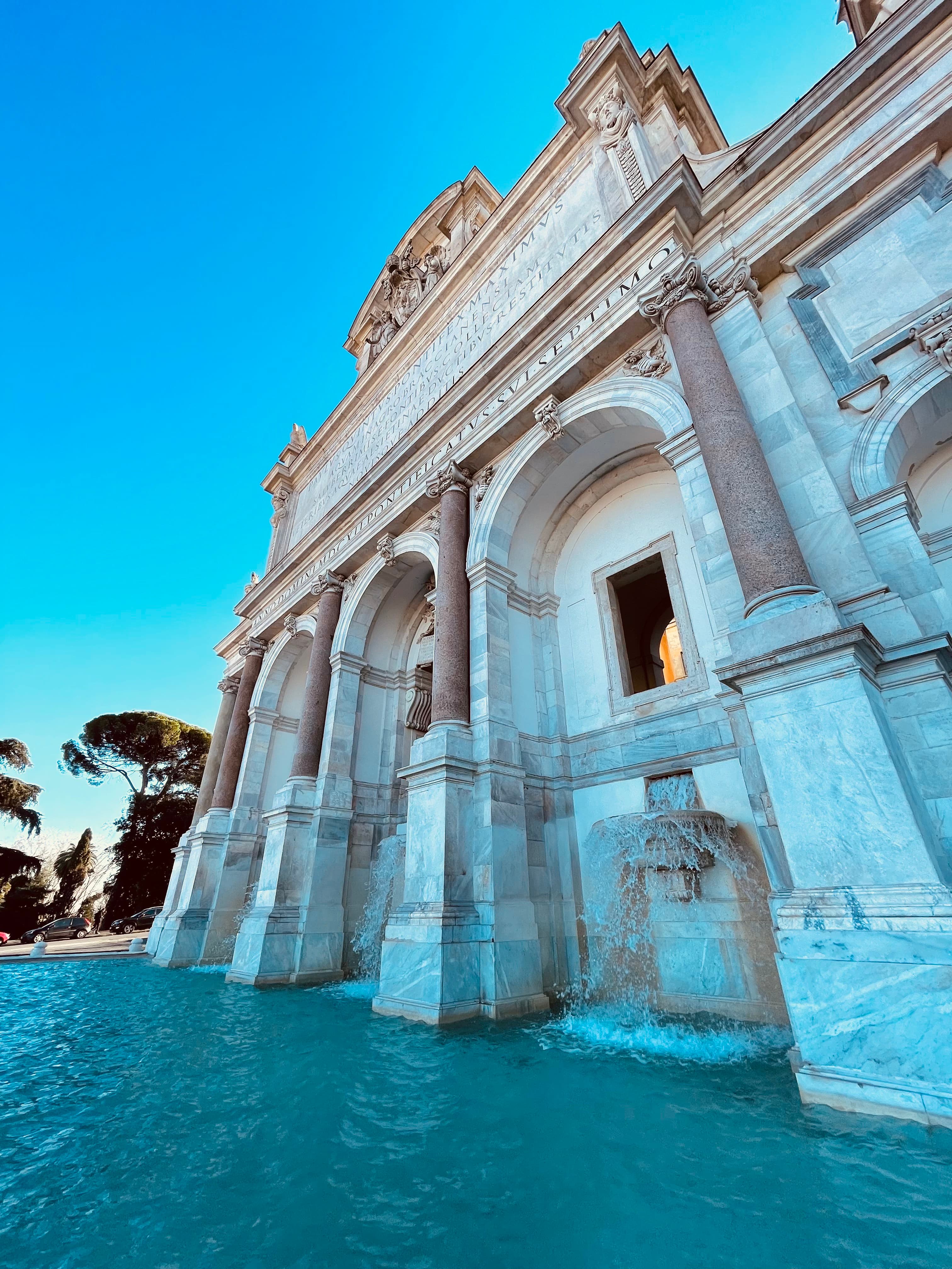 A white building beside a pool