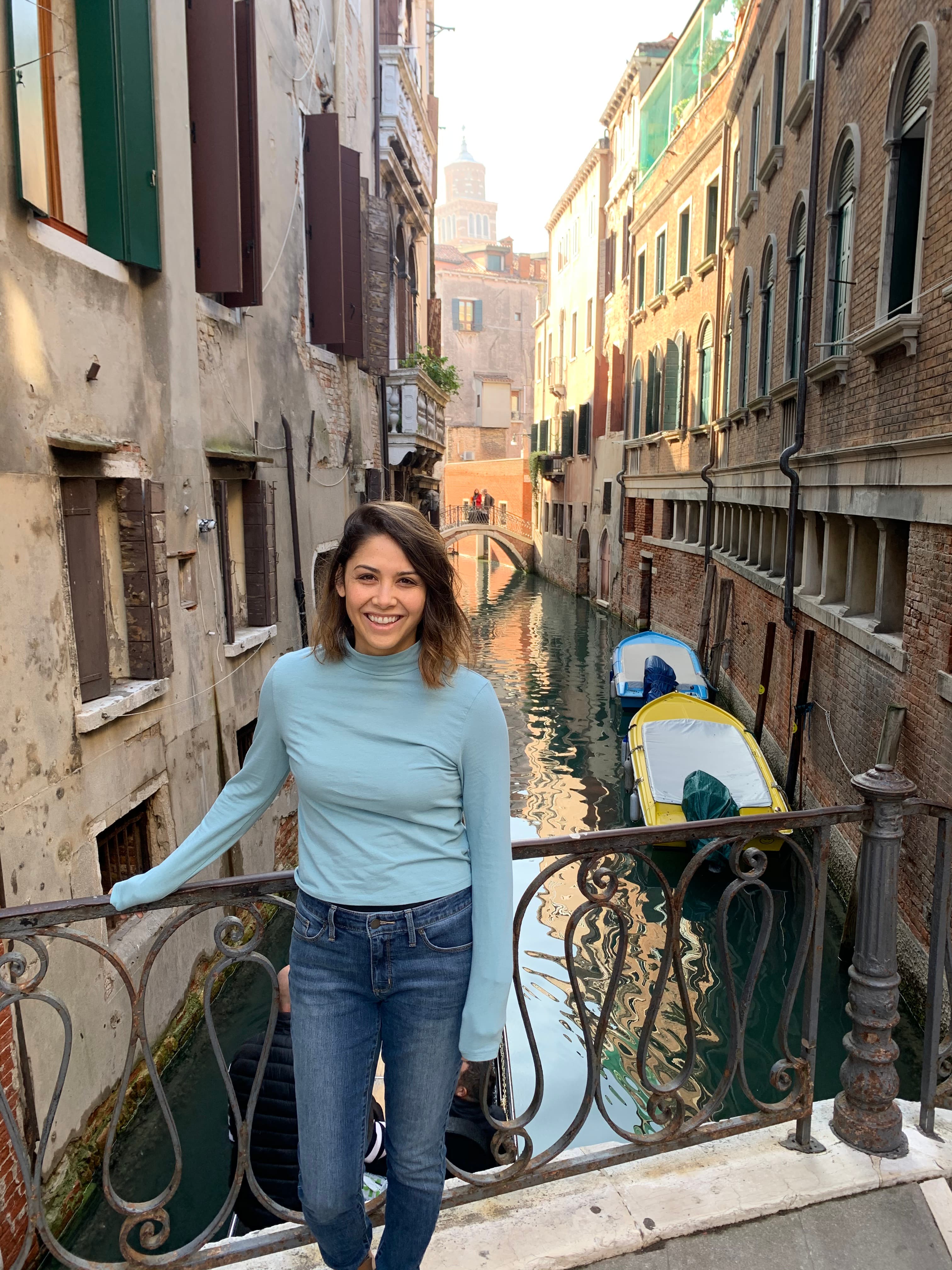 Travel advisor posing in a water street