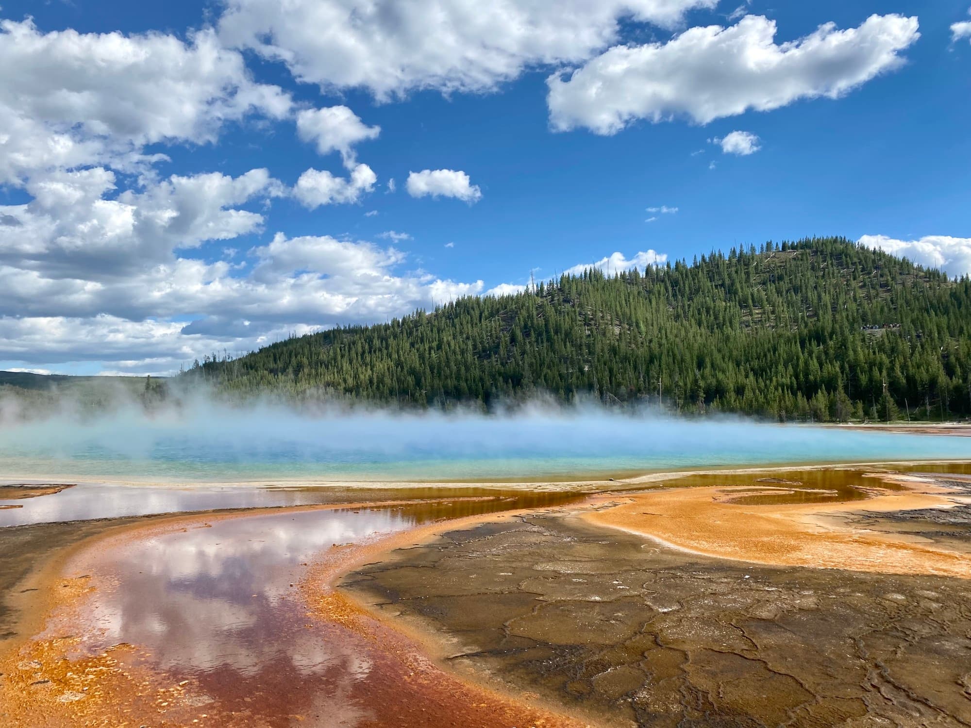Foggy land with green hill.