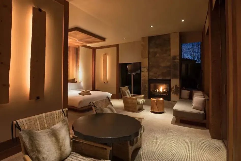 cozy hotel room with a stone fireplace