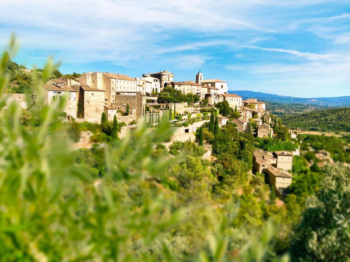 Village on lush hilltop in the South of France on a sunny day. 