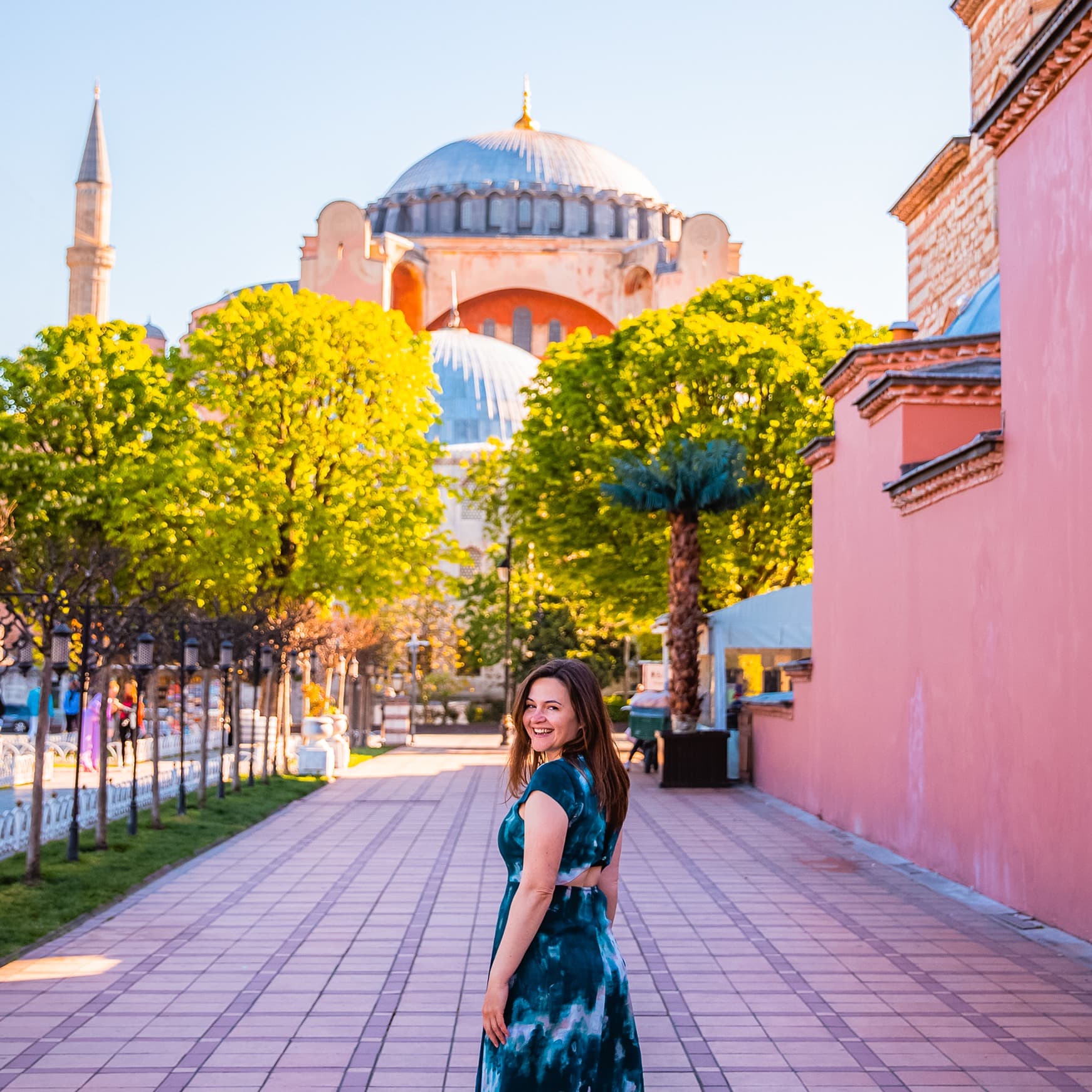 Adviser Pam Hughet taking picture in front of a beautiful mosque
