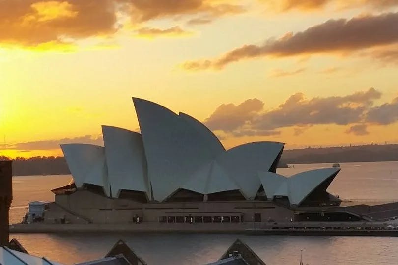 Sunset view of the  iconic multi-venue performing arts center Sydney Opera House.