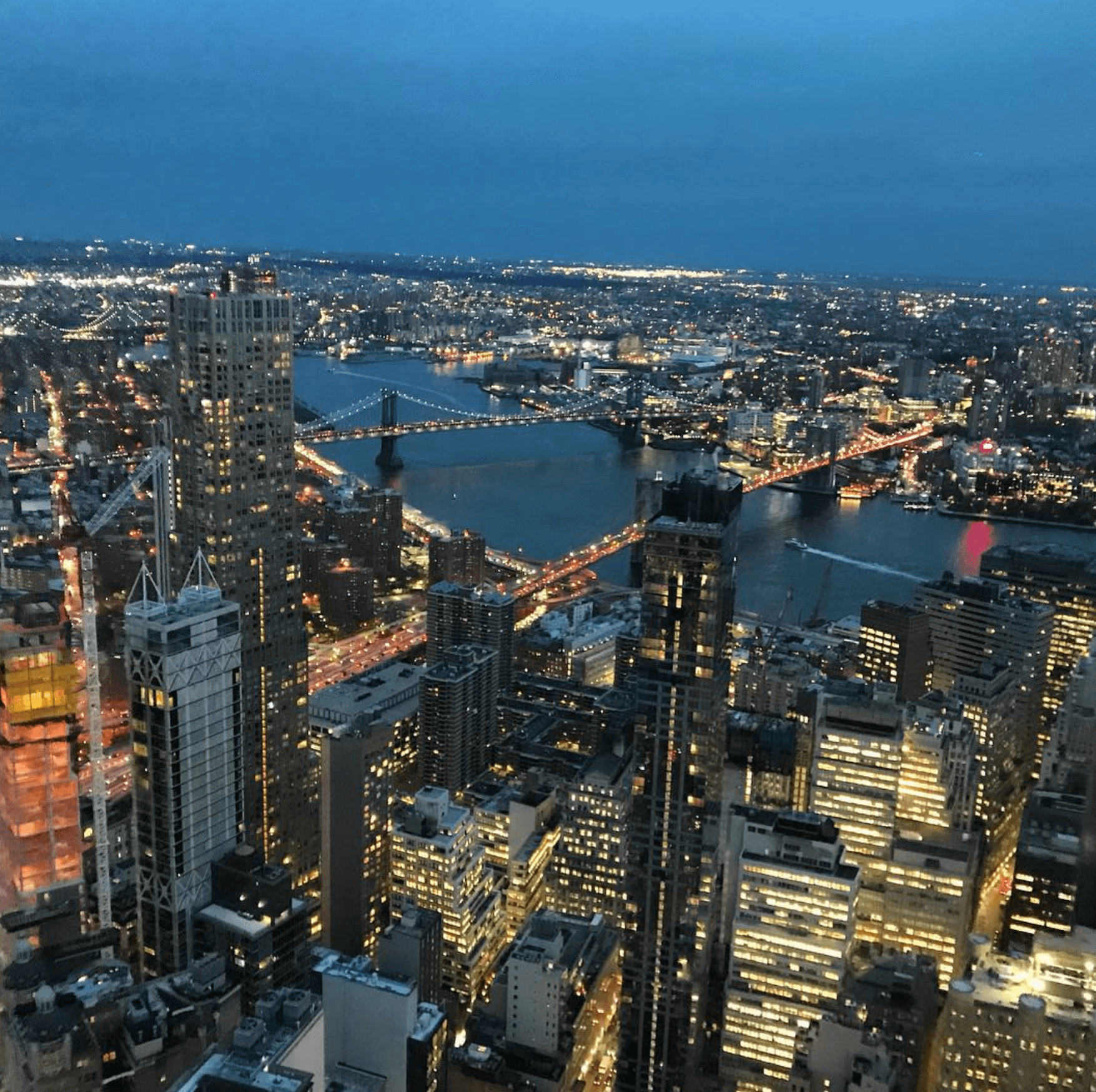View of a city skyline at night.