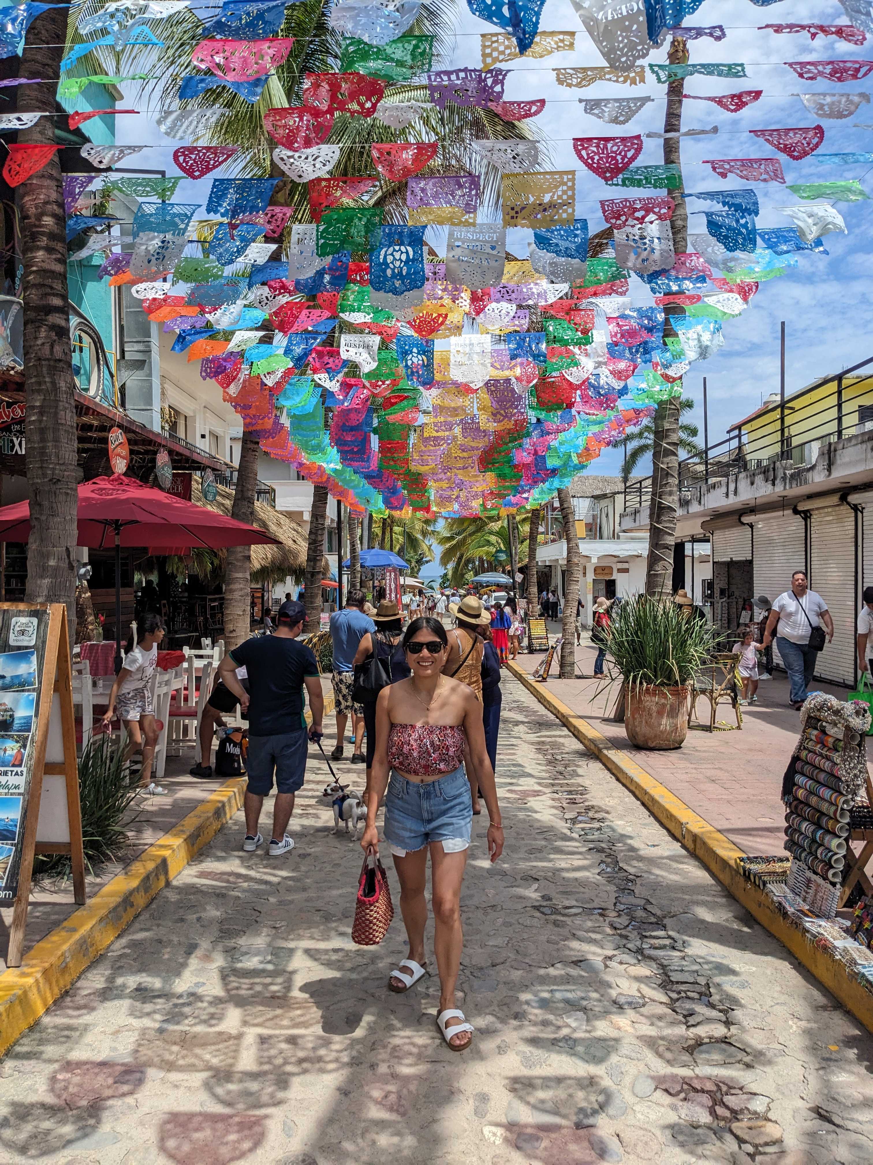 Princess Sambiley taking picture under umberellas
