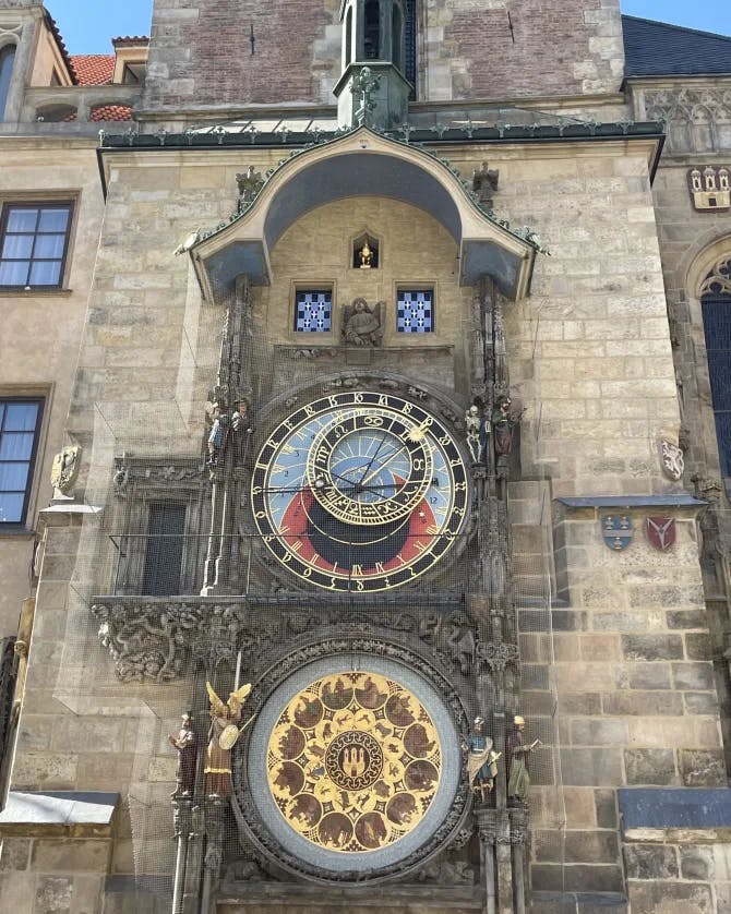 ornate clock on an old stone building