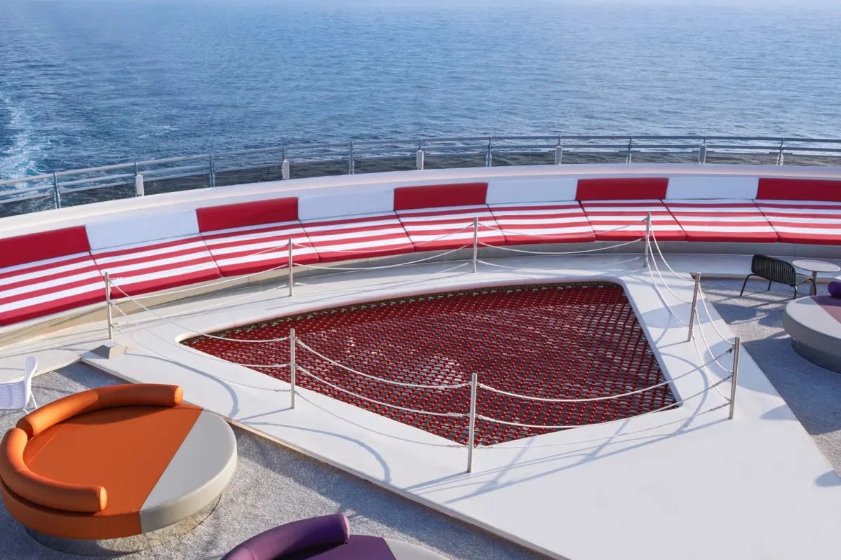 red plunge pool on a cruise ship deck