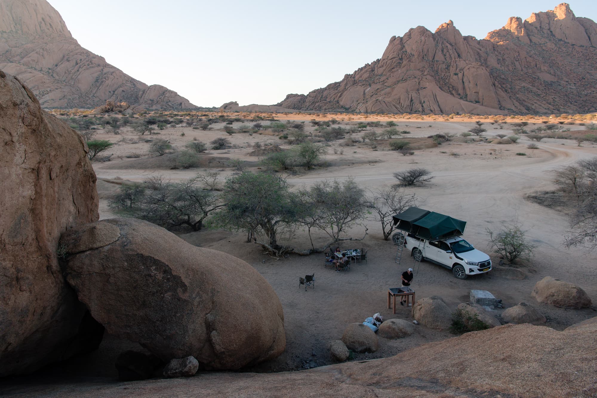 A vast desert with a car.