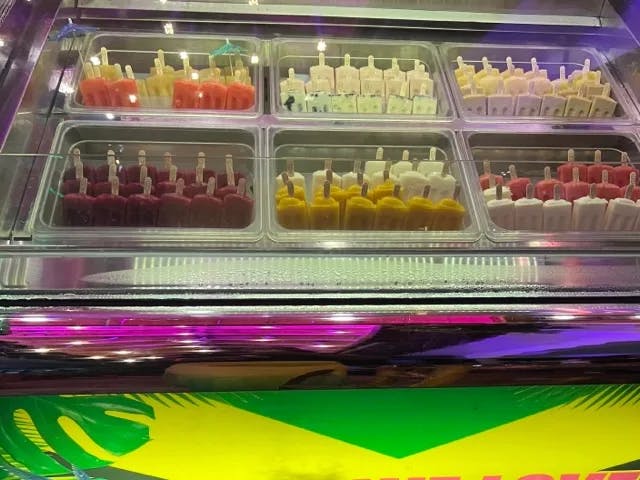 Colorful popsicles on display at a freezer. 