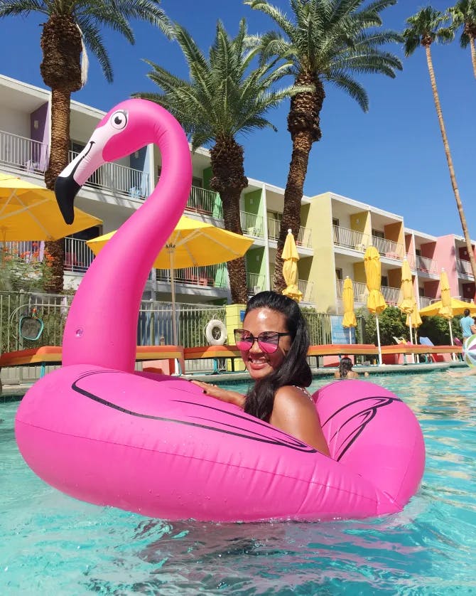 In the pool with a pink flamingo tube