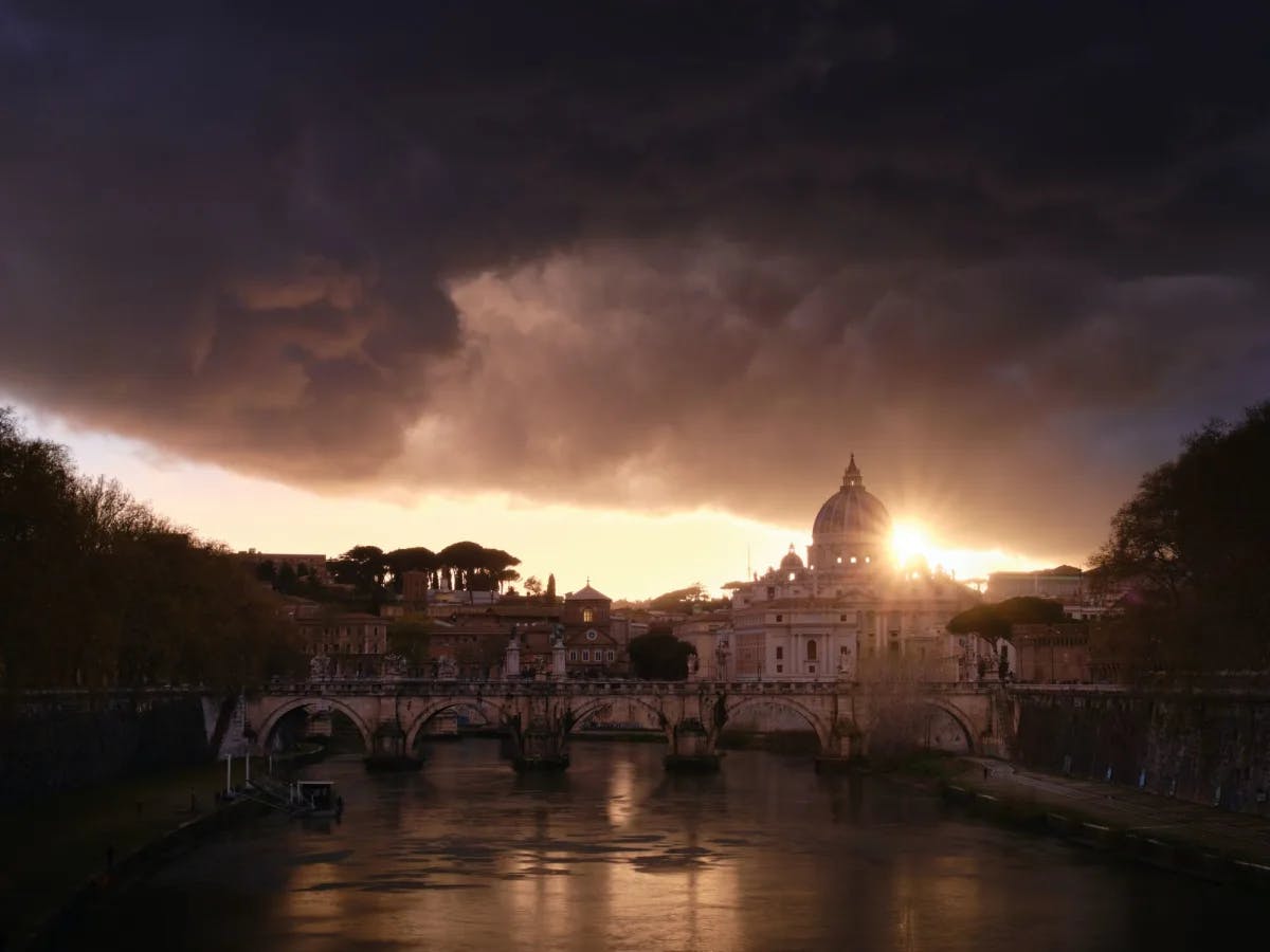 Sunset over city canal and Vatican. 