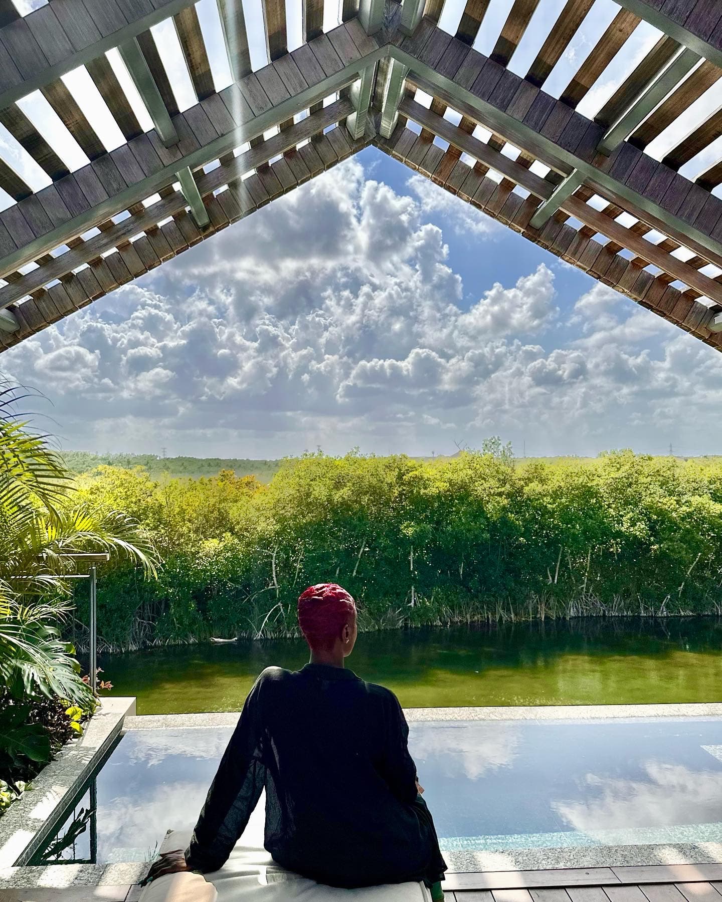 Travel advisor posing on a pool