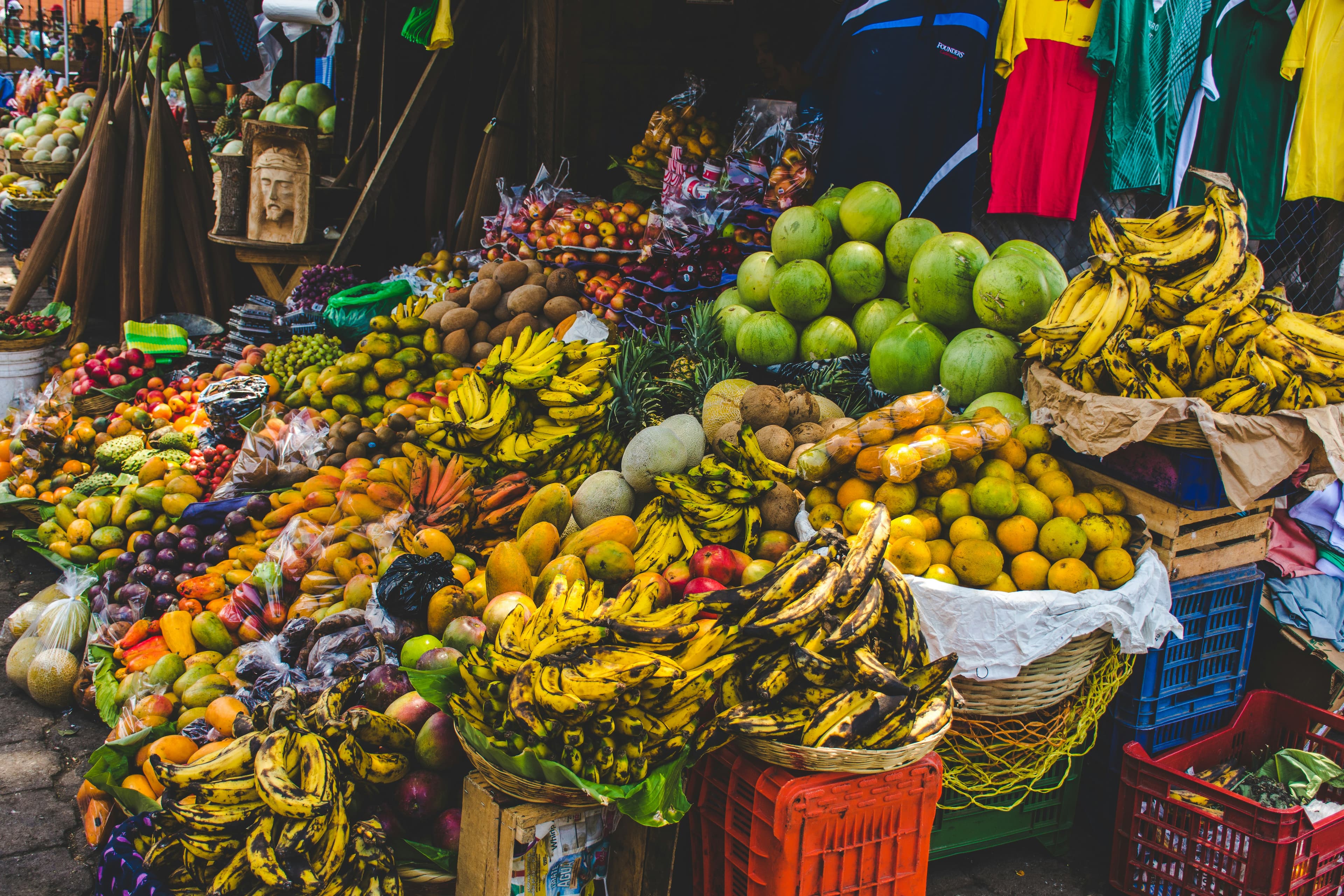 A beautiful outdoor market with a lot of fresh fruit
