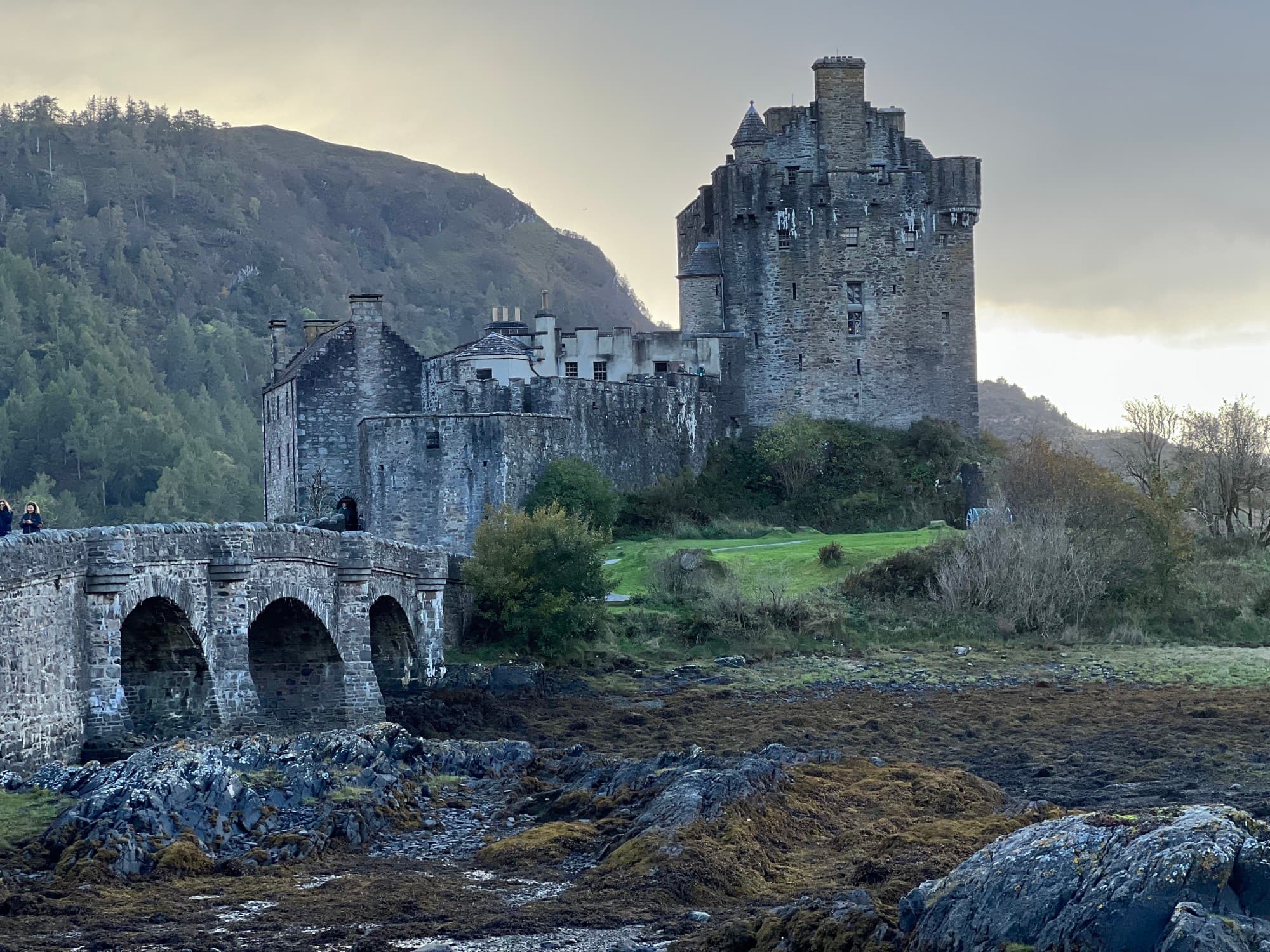 ancient stone castle and bridge at sunset