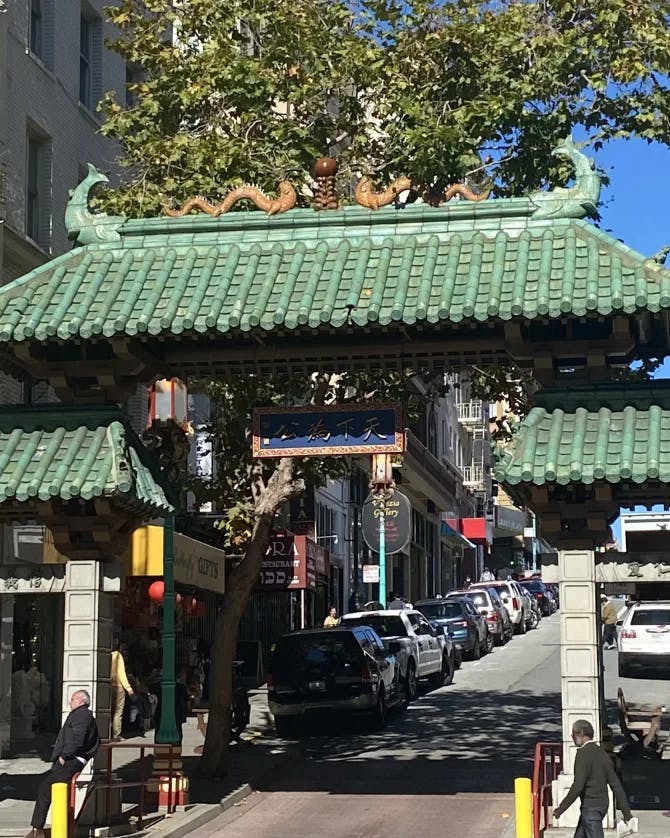 Picture of Dragon Gate Chinatown SF with a green tile roof. 